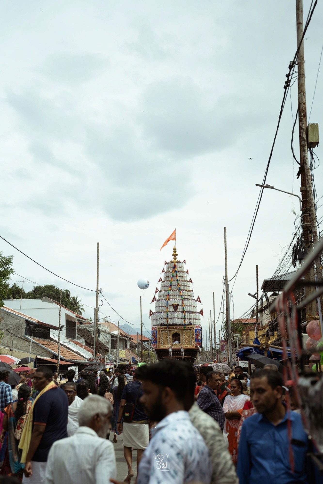 Crowds gathered around the temple chariot at Kalpathi