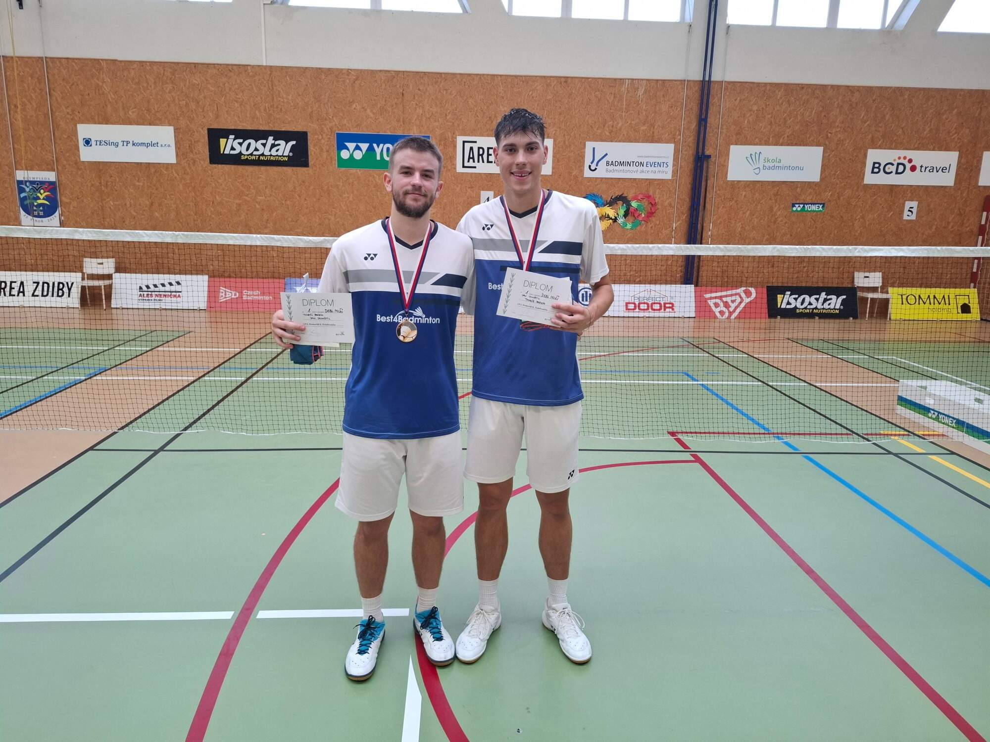 a japanese style building with a japanese roof and trees around it