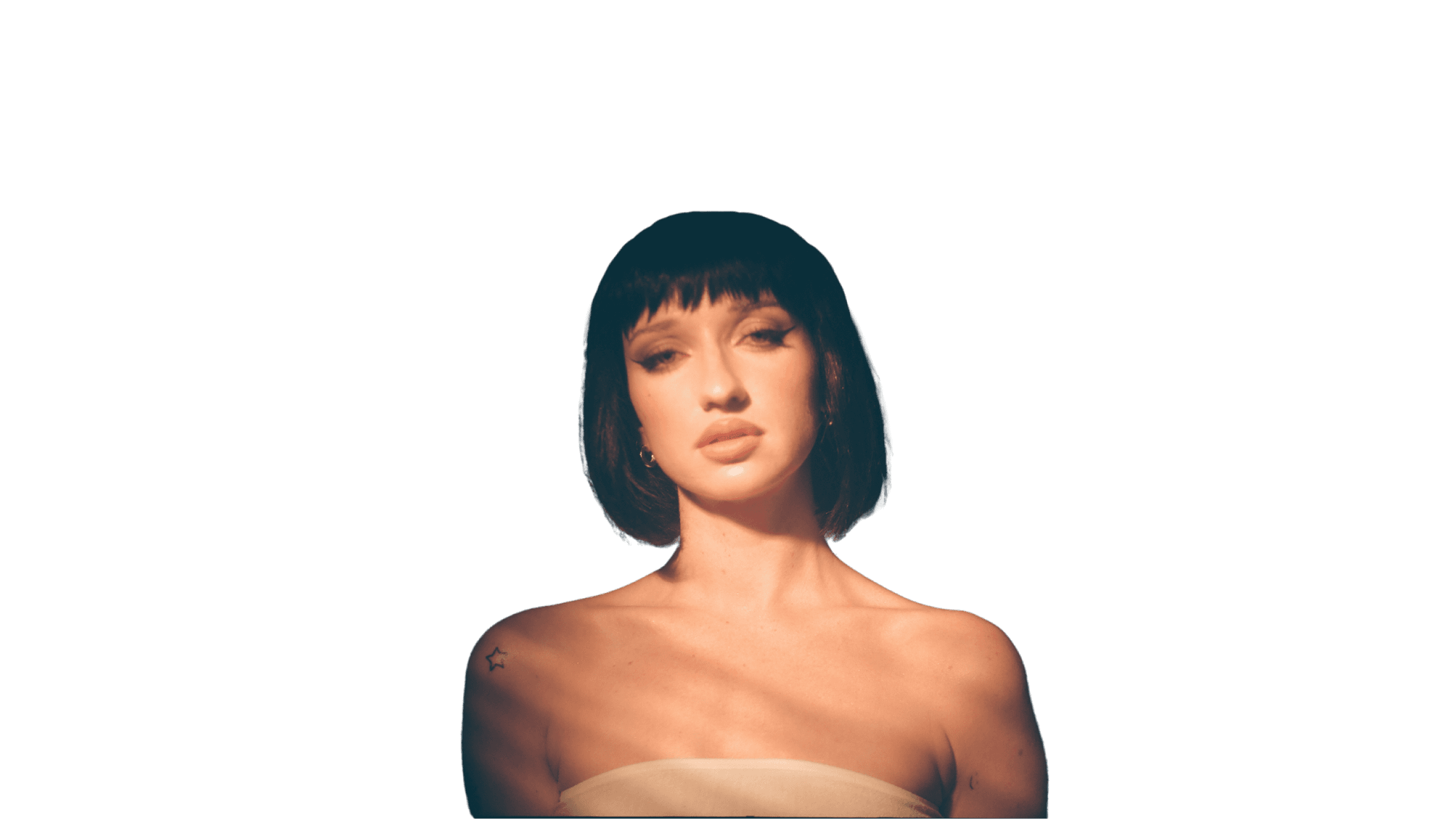 Stacy Ryans with short black hair stairing moodily at the camera