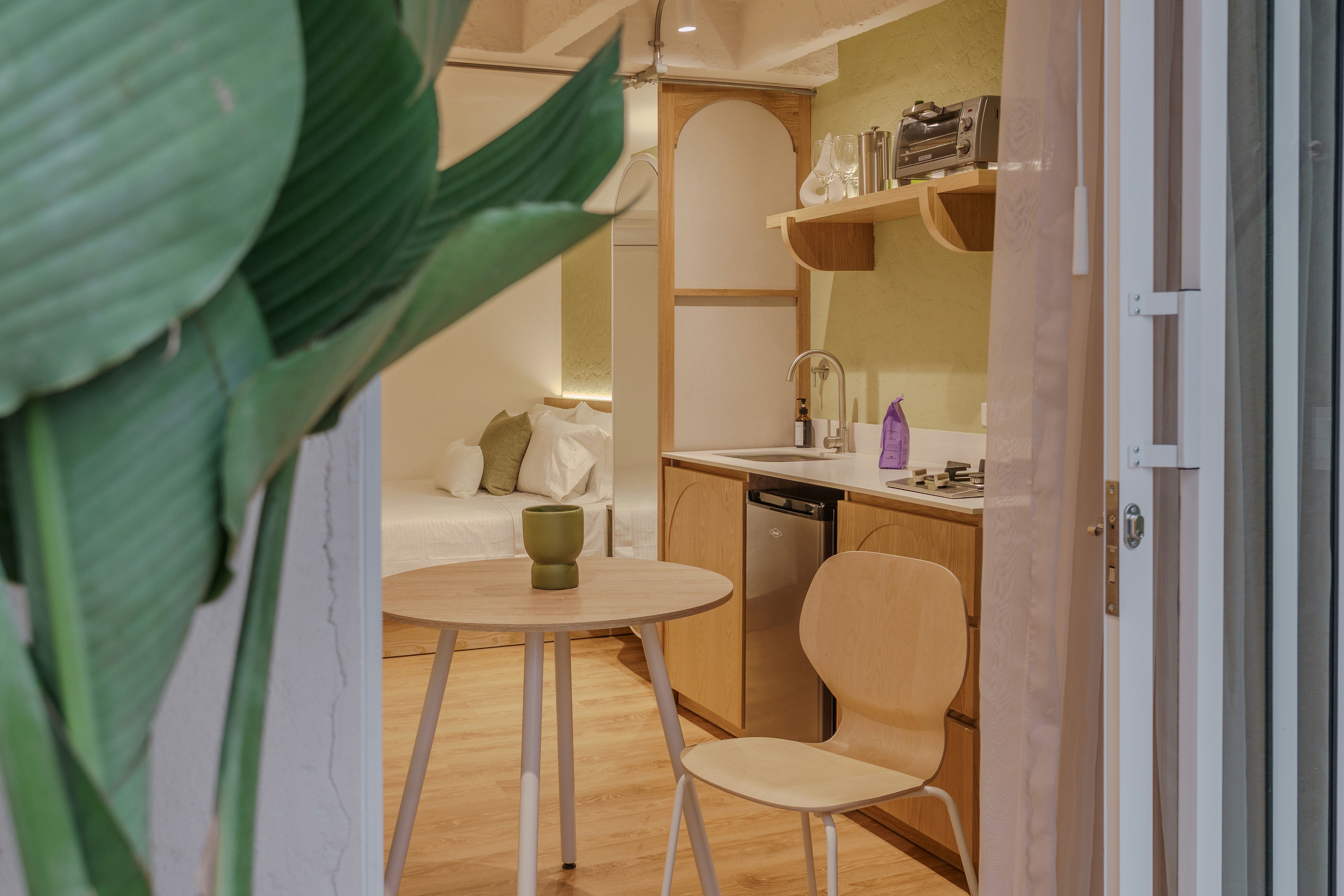 Double-height interior with flowing sculptural forms and warm raking light