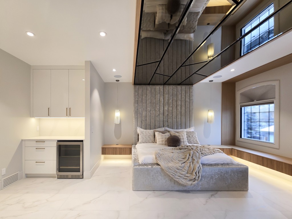 Image of Luxury primary suite with modern furniture, layout design, and KHD Homes design-build construction expertise.