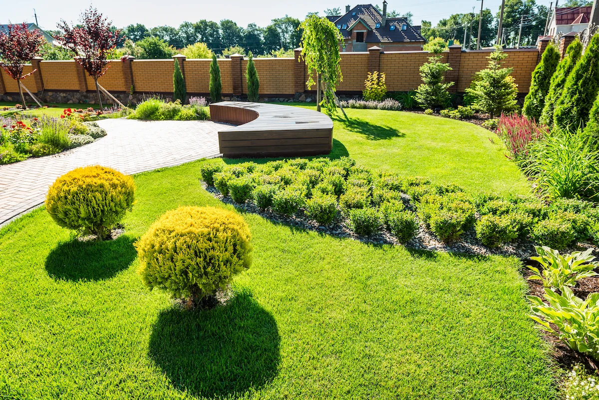 Manicured estate garden with structured gravel paths