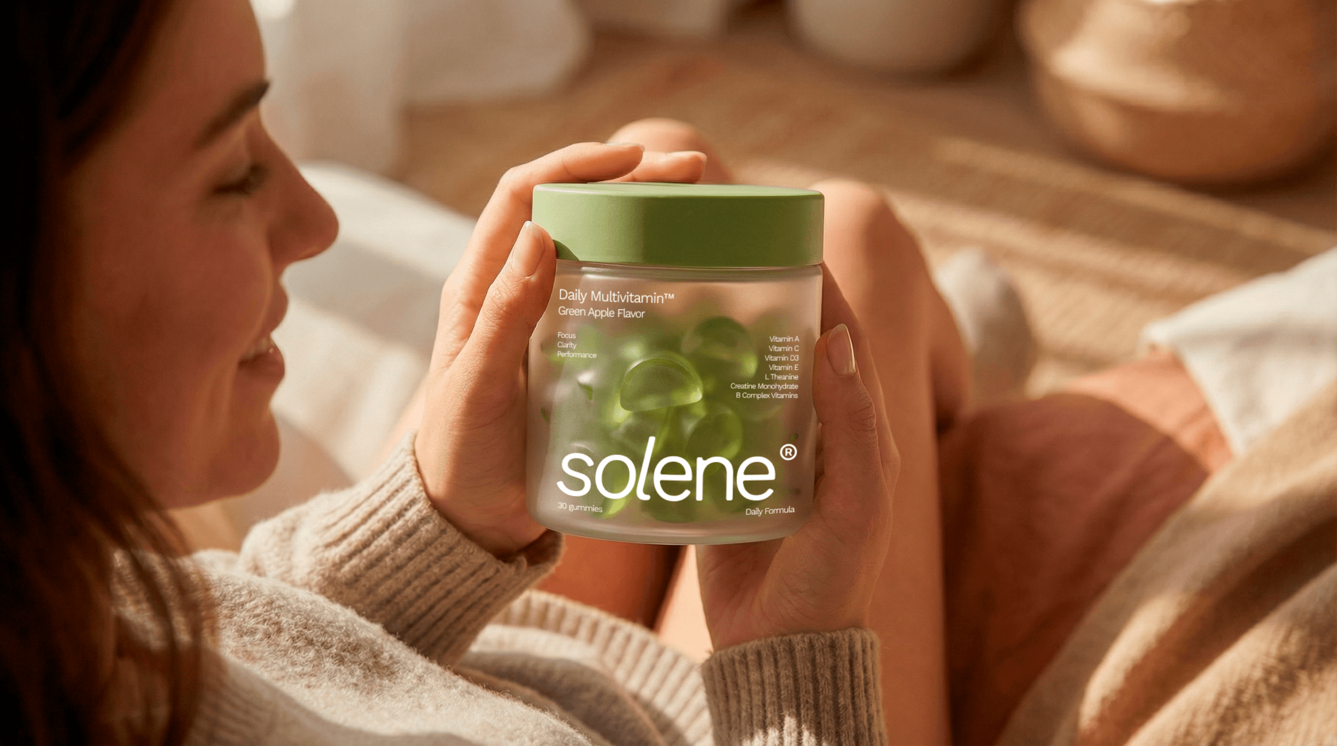 A women with pot of gummy on hand 