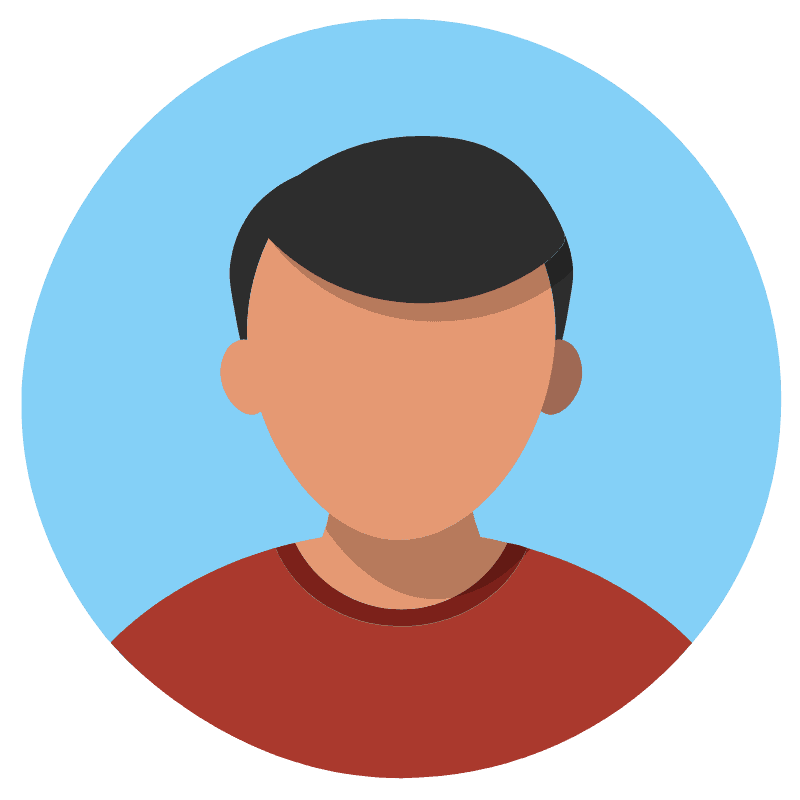 smiling man standing near green tree