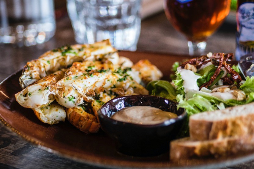 cauliflower wings and a side salad with dressing