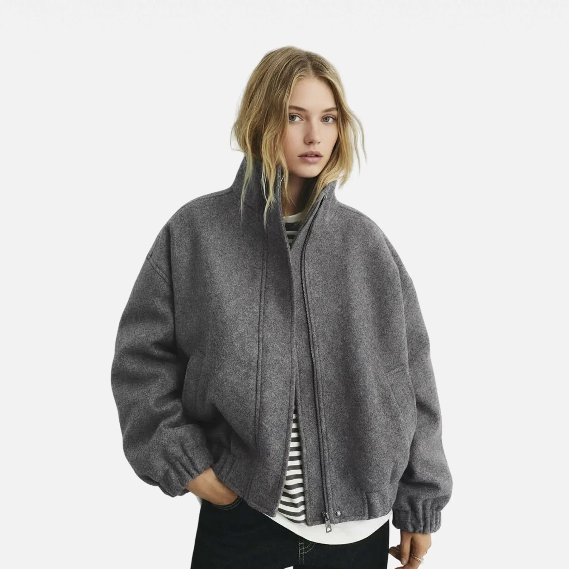 Woman wearing a gray jacket on a white background