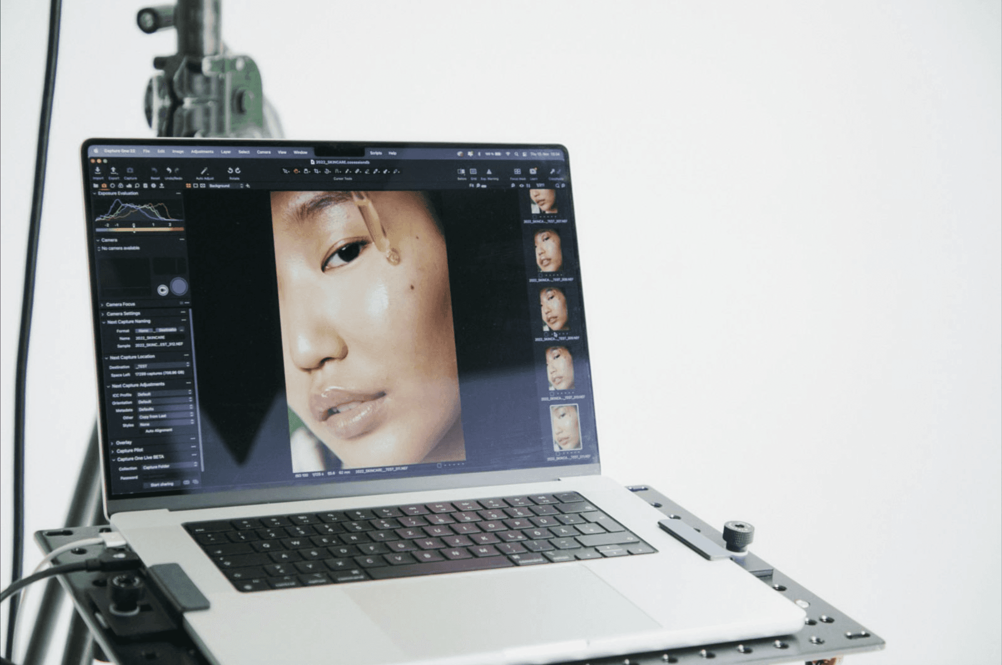 Black and white image of people working at a table with laptops, showing hands gesturing during discussion of digital content displayed on screens, with fabrica® logo in the corner.