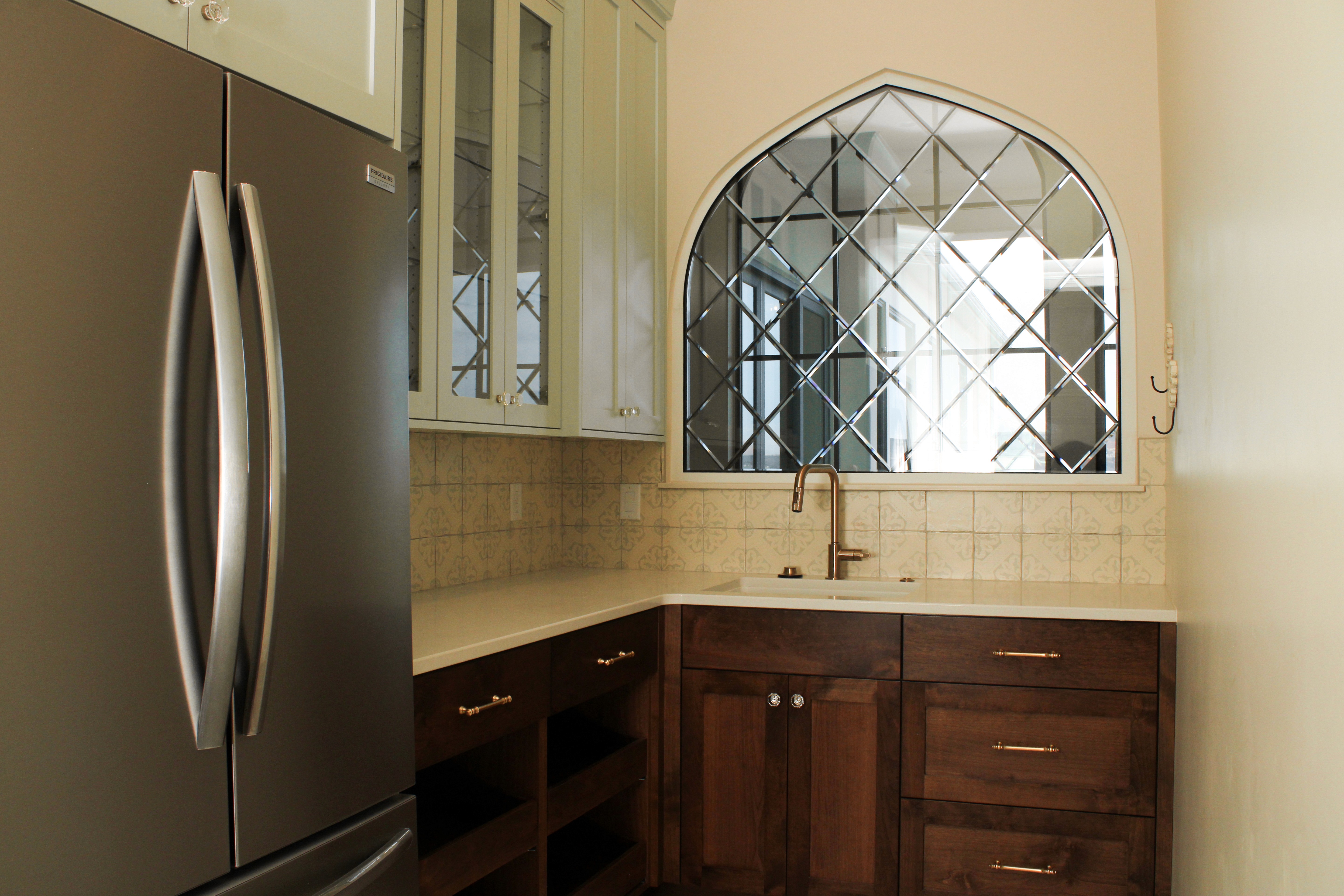 Pantry with built-in fridge, sink, and storage in a St. George, Utah custom home.