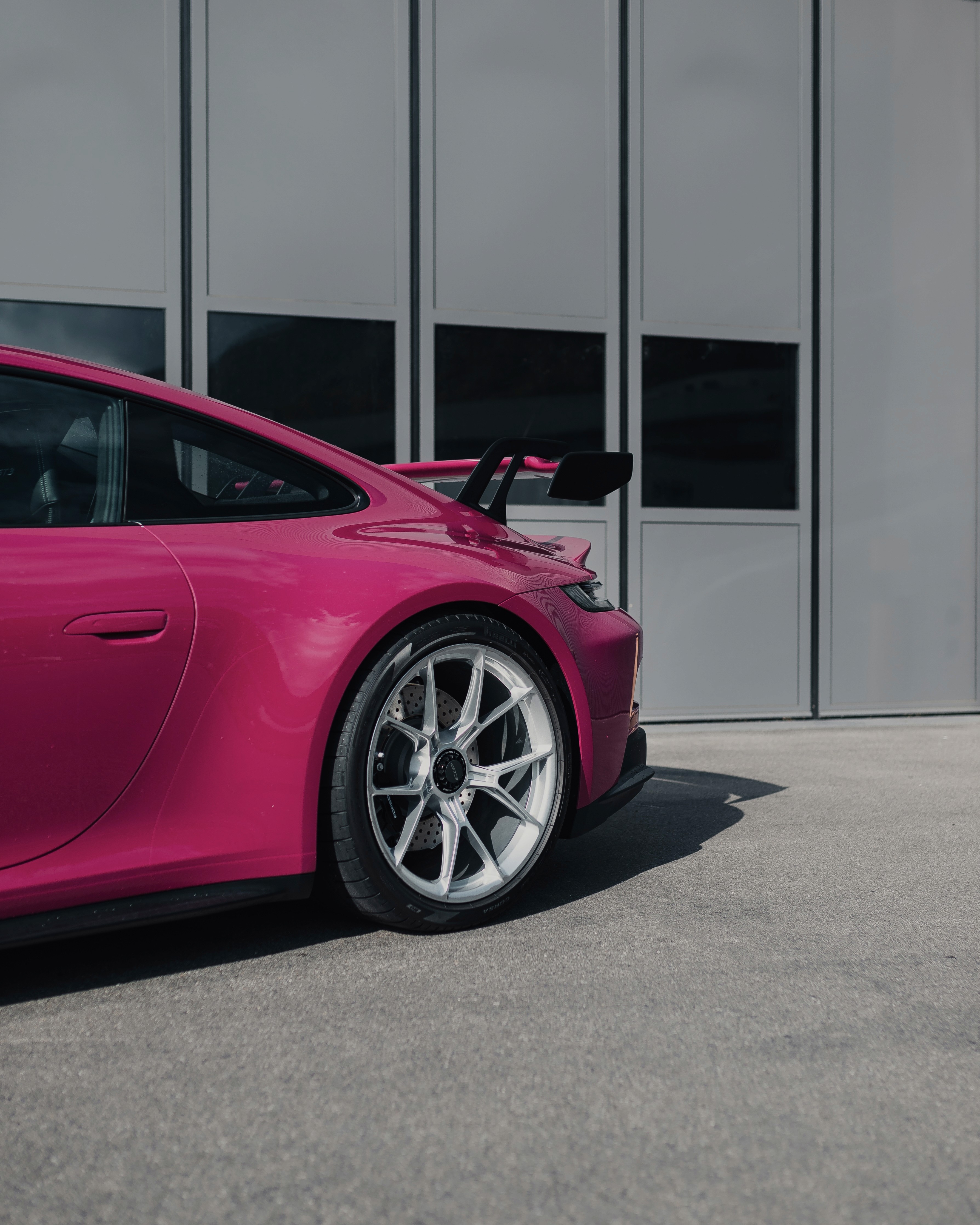 Luxury cars parked inside store.