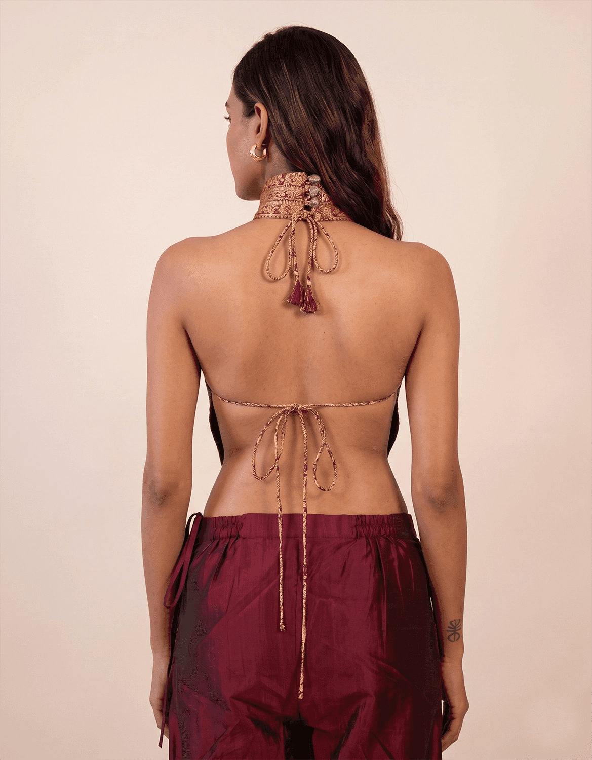 Apsara is our high-neck, backless top crafted from a vintage silk saree, inhouse by skilled artisans.