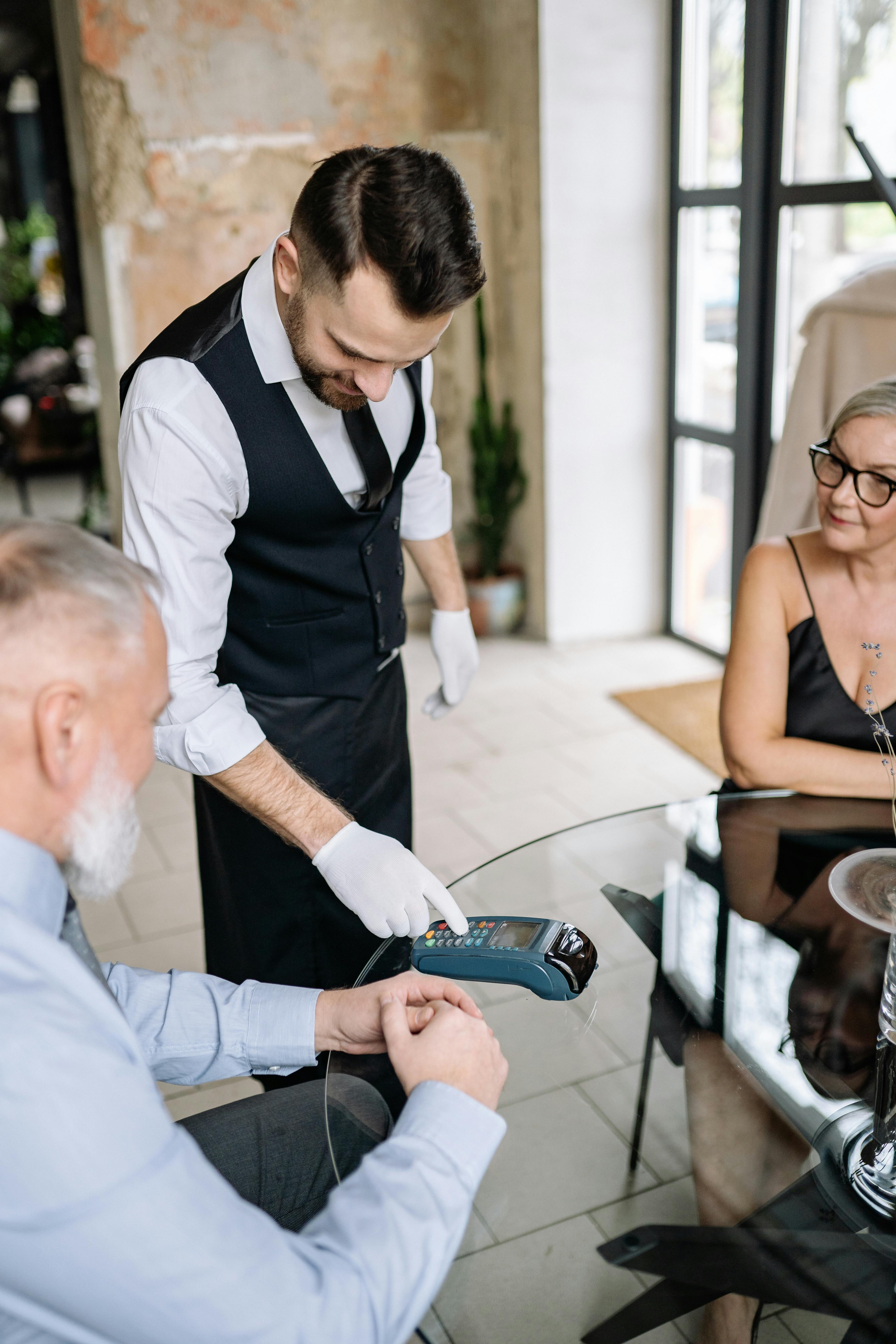 person making a contactless payment with a card