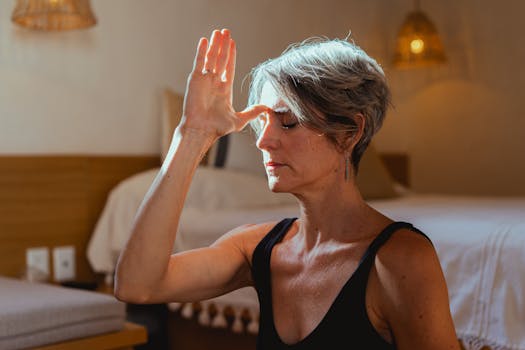 Woman practicing yoga for stress relief during menopause