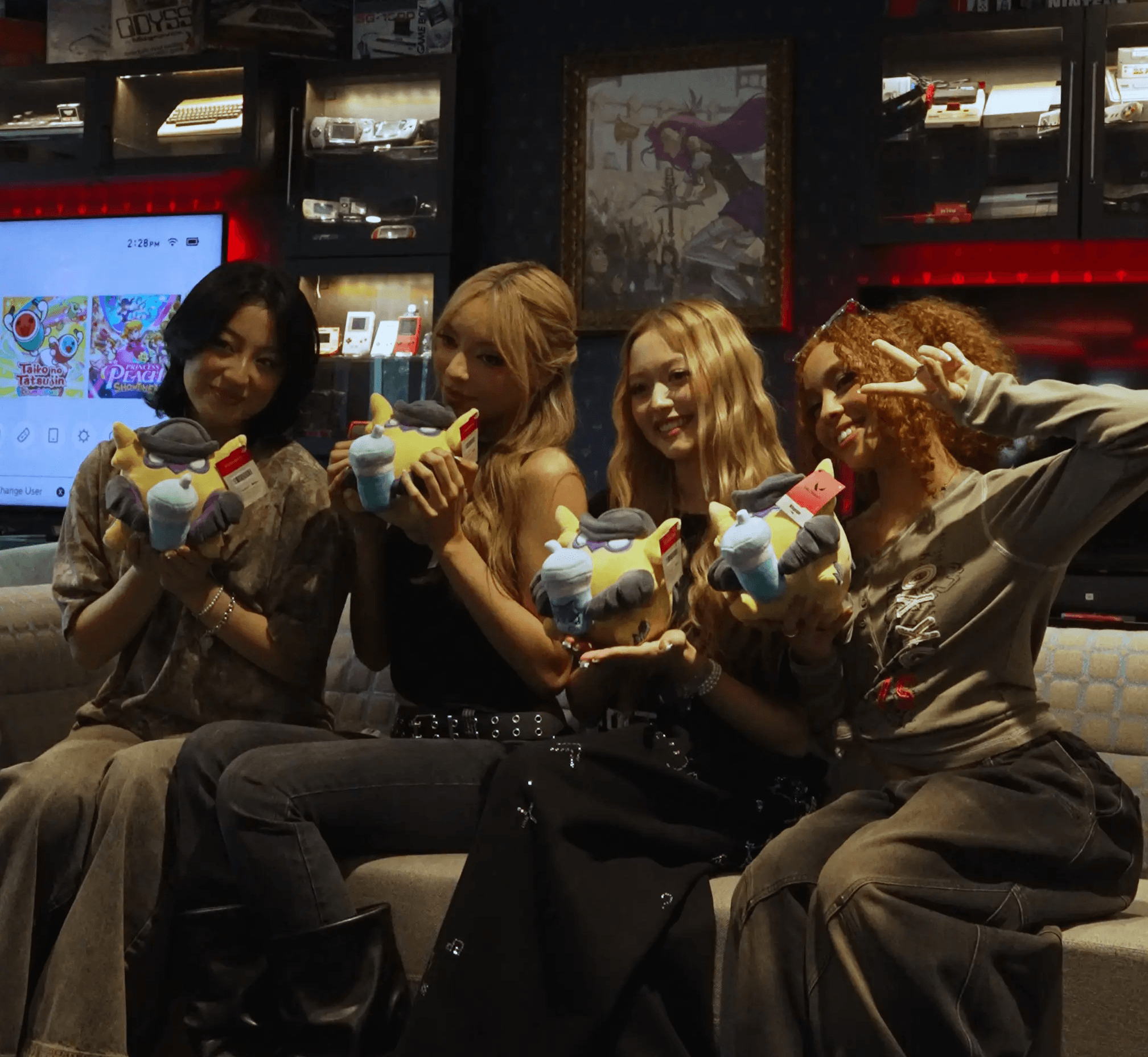 GIRLSET holding VALORANT's Wingman Plush and posing for a picture