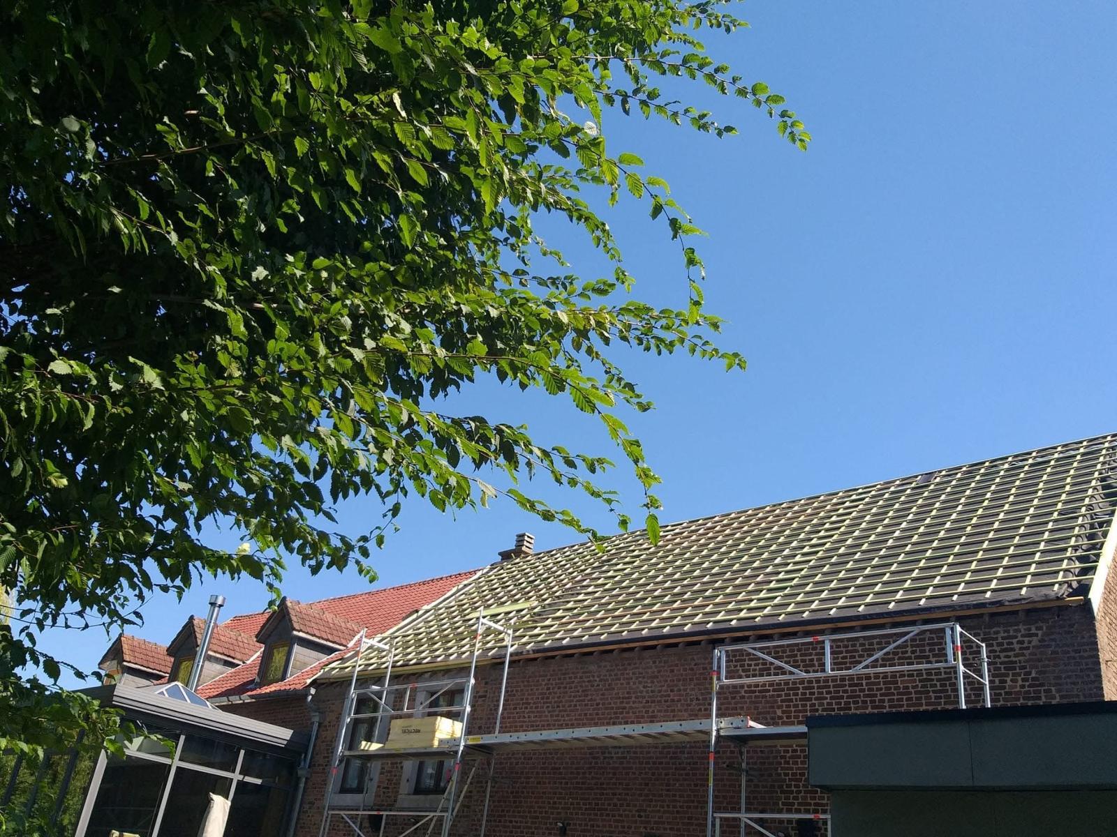 gray and black building under white clouds