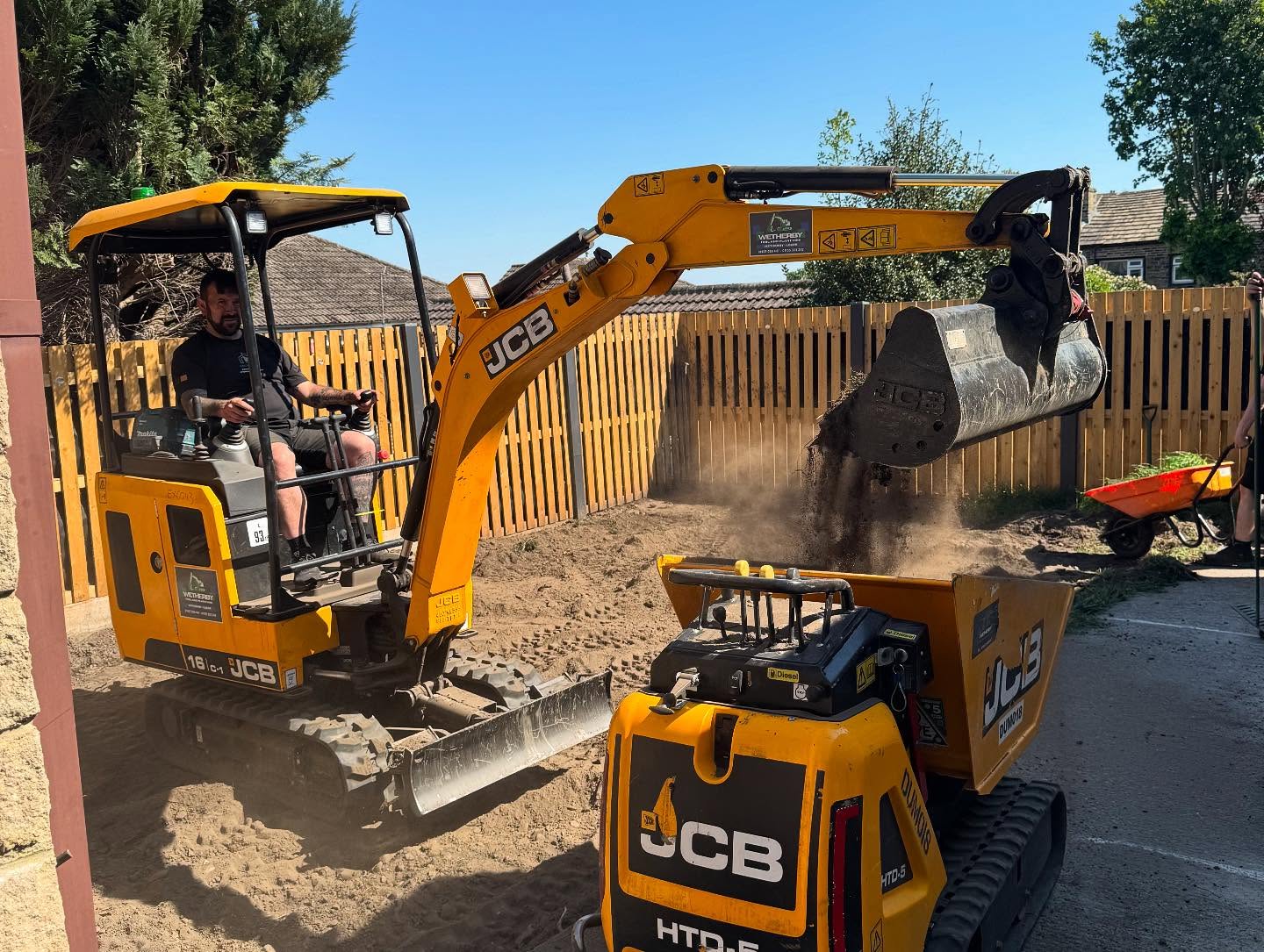 Mini excavators preparing the ground for an Archella landscaping project