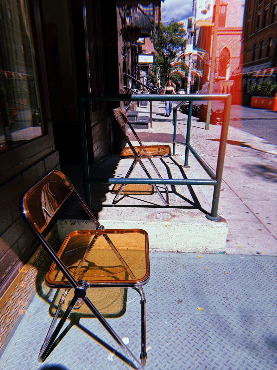 Amber chairs and their shadows Photograph by Pranjali Shah.
