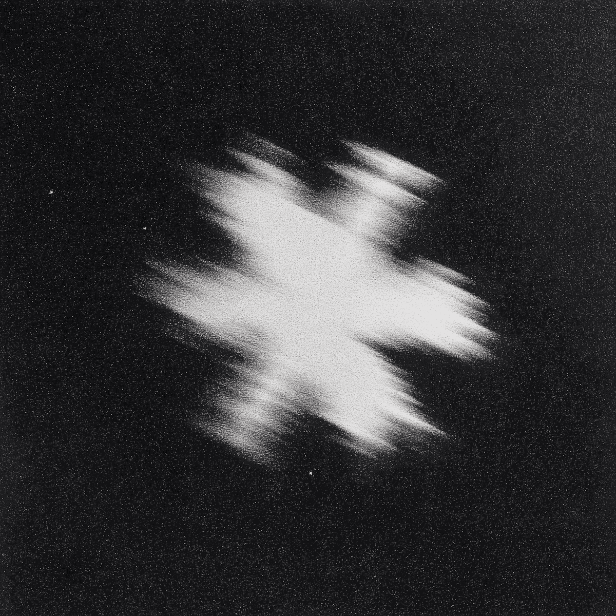 Bright white, streaky light burst on a grainy black background.
