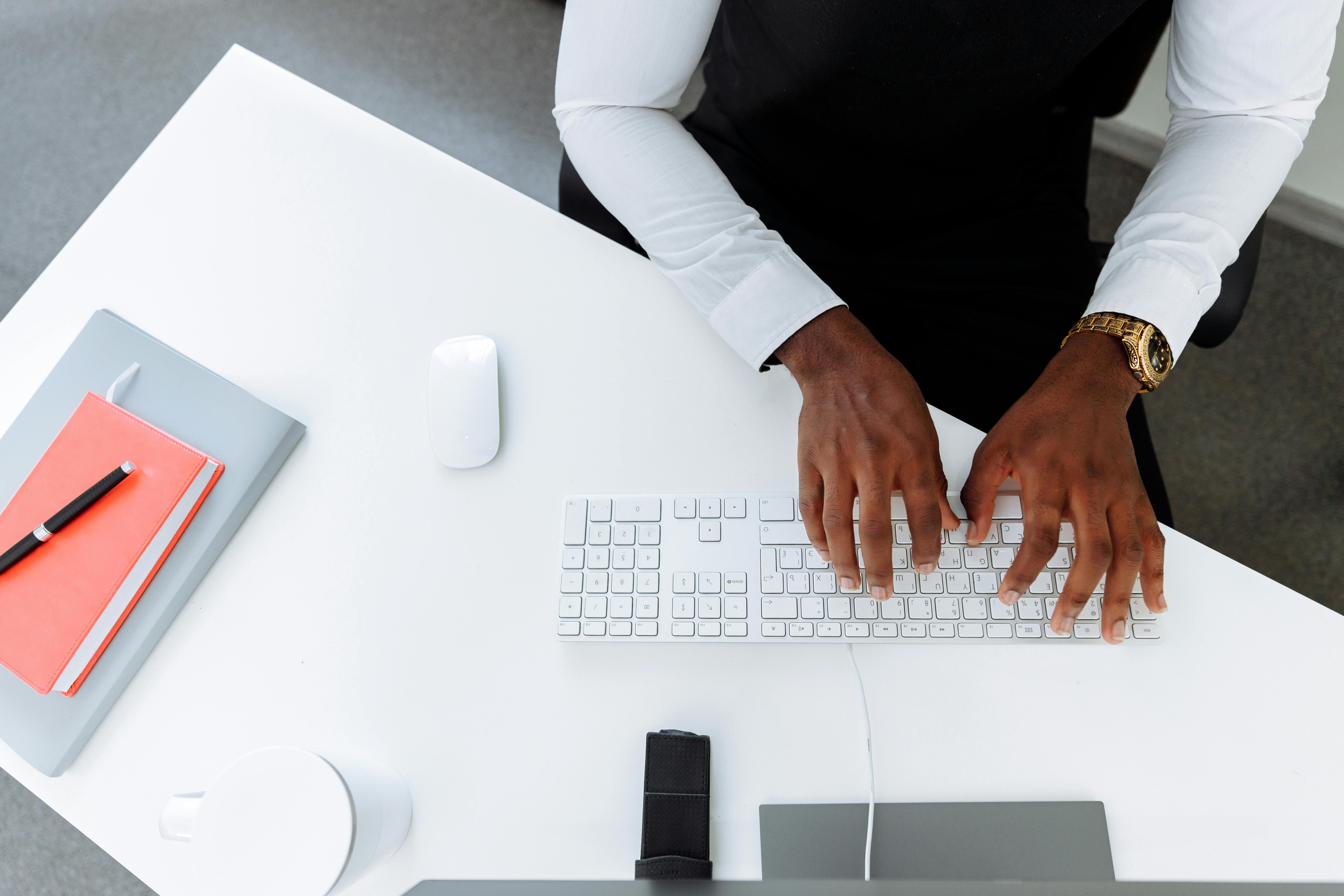 Two silhouetted figures are seen in a softly lit room, engaged in conversation, with sunlight filtering through a window.