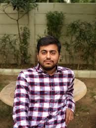 smiling woman wearing white and black pinstriped collared top