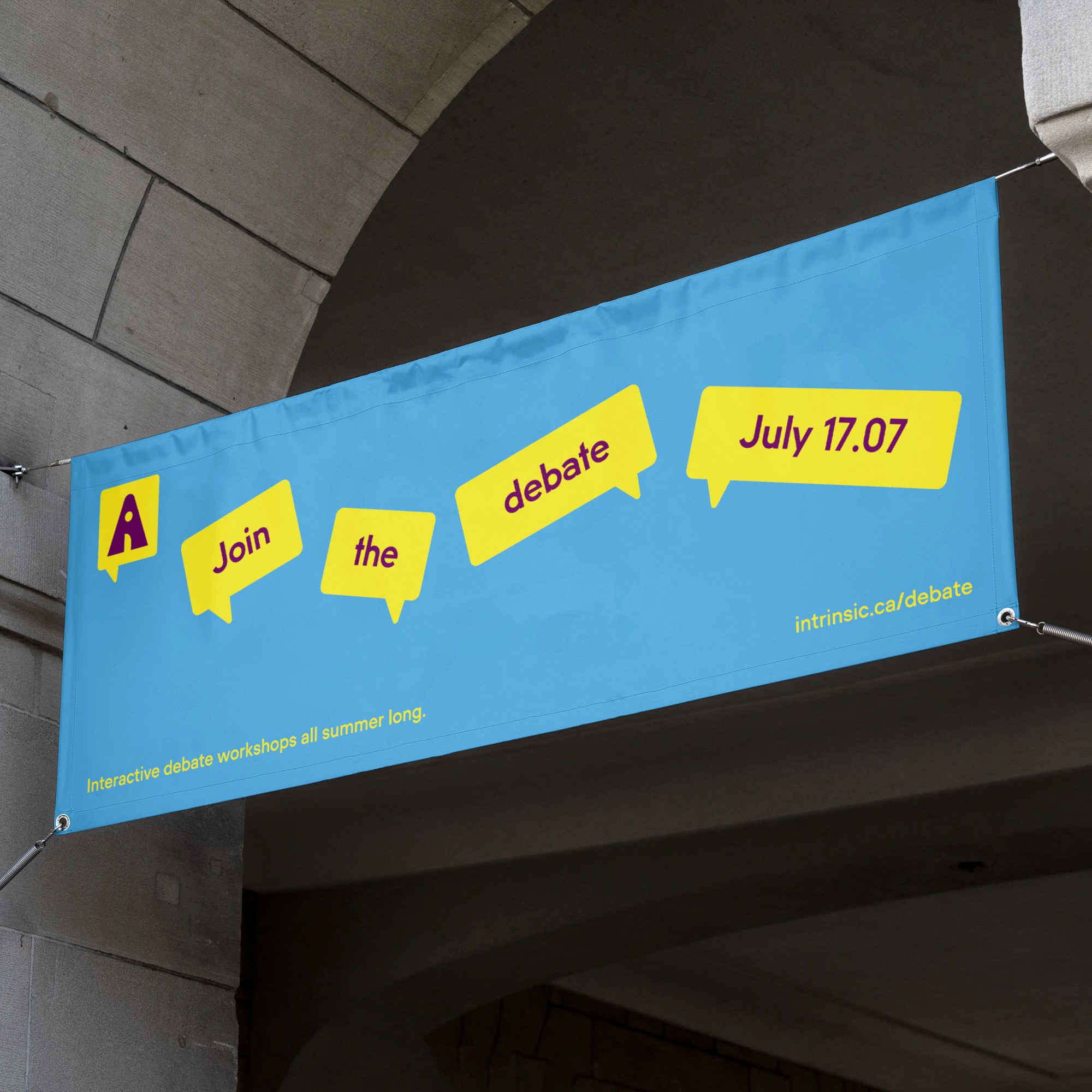  Banner under an archway with "Join the debate July 17.07" in speech bubbles on a blue background, and text below reads "Interactive debate workshops all summer long. intrinsic.ca/debate.