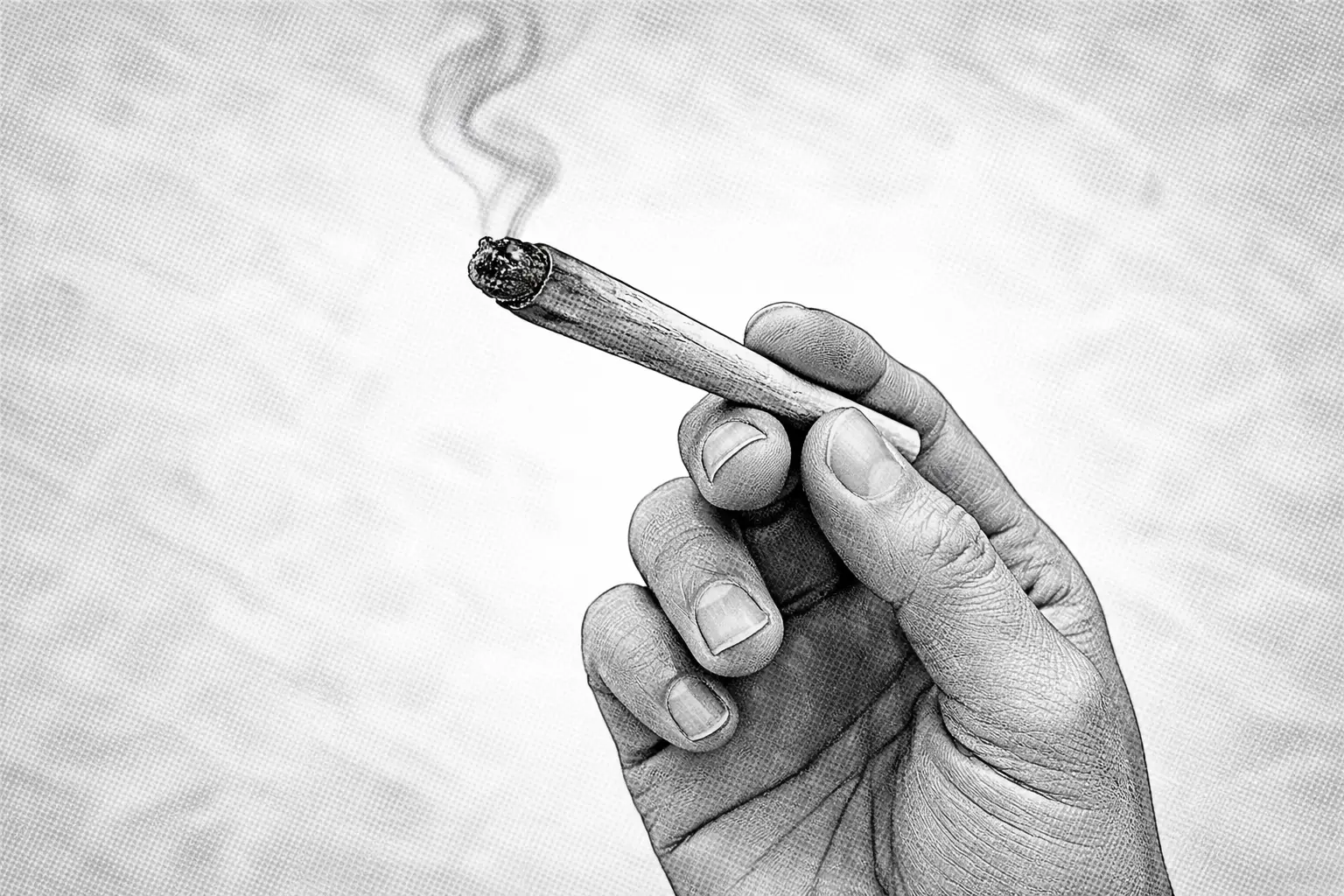 A hand holding a cigarette, with smoke curling upward in a monochrome setting. Cover image for local SEO expert blog.