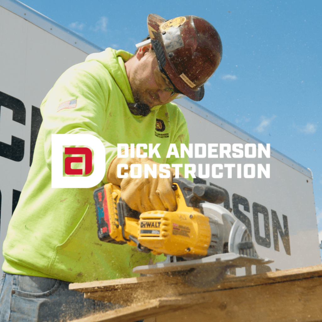 Construction worker operating heavy machinery at a Dick Anderson Construction project site in Billings, Montana