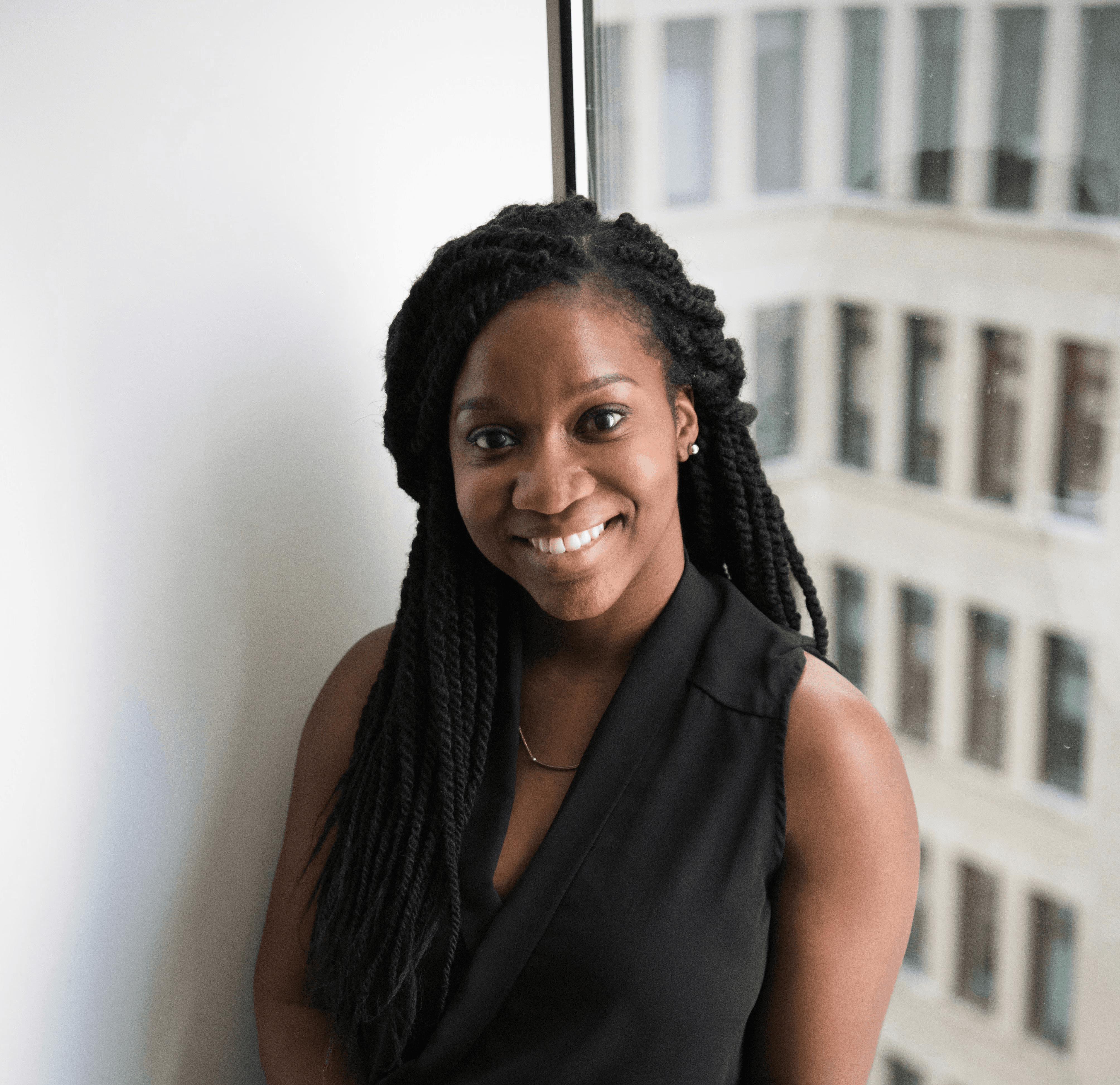 woman sitting next to window