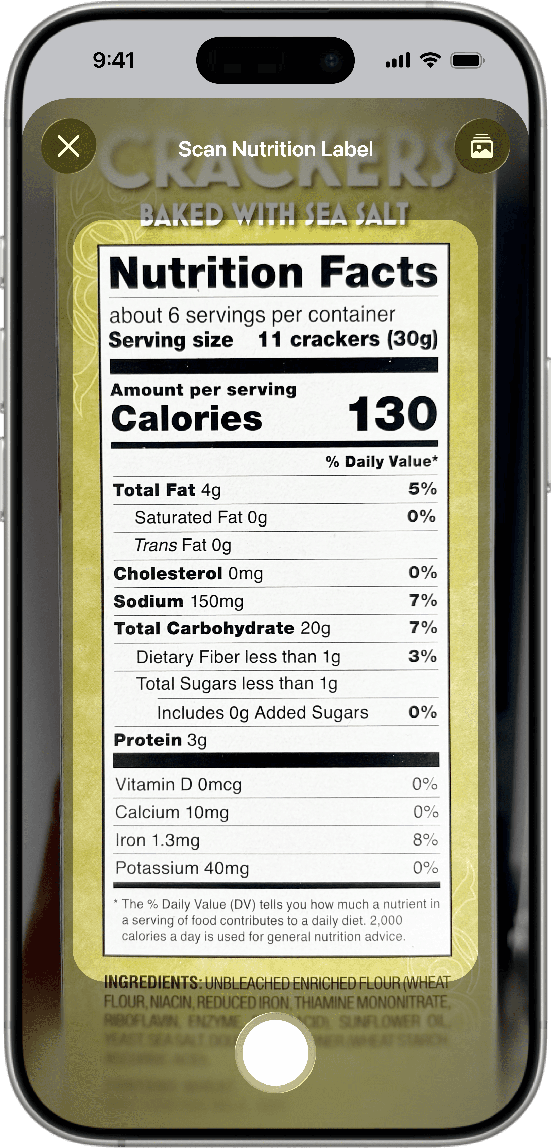 Foodnoms app scanning a nutrition label to automatically log food and track calories, fat, sodium, and protein