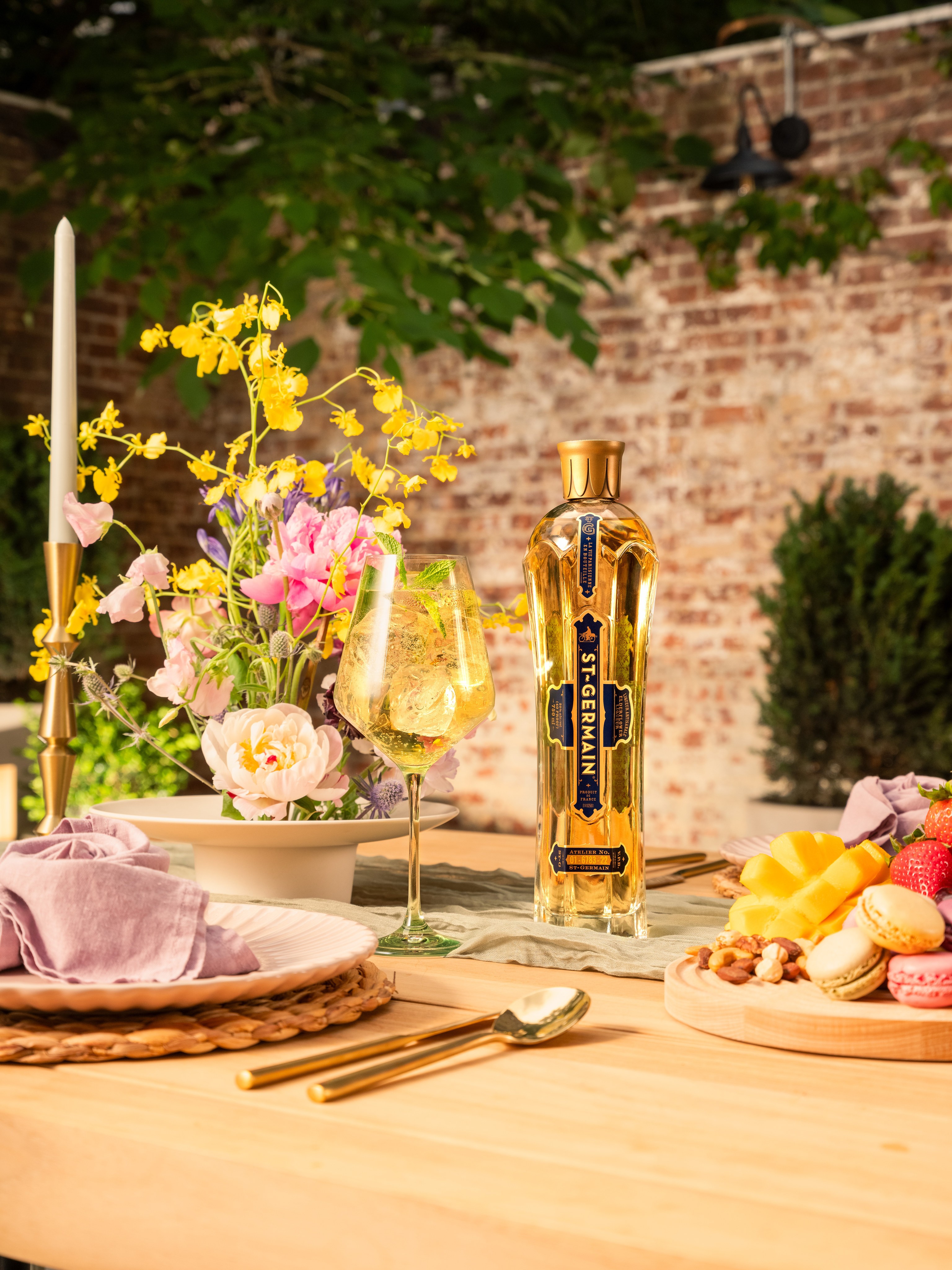 St Germain bottle and glassware arranged across the Avant Garden tablescape