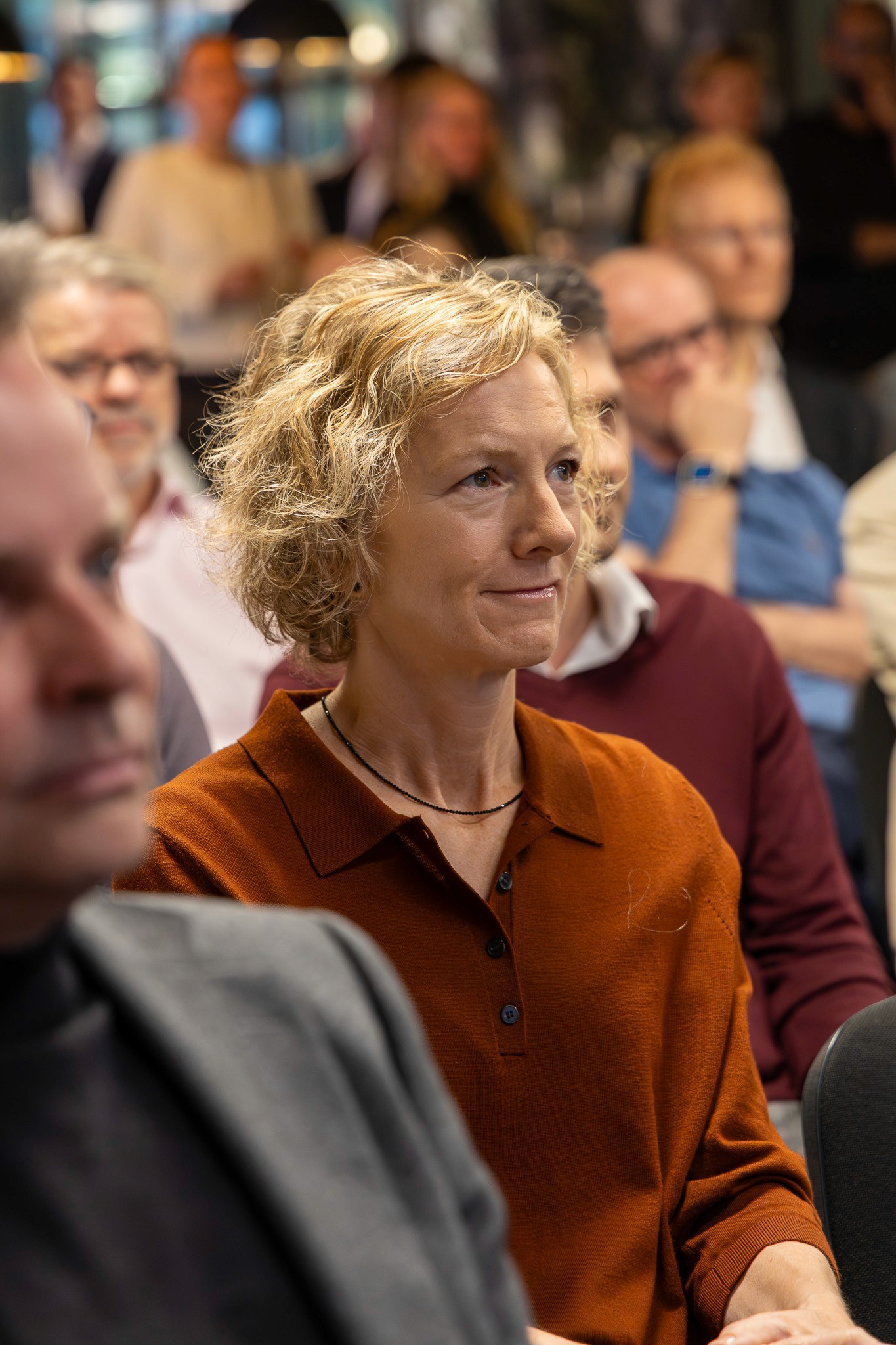 Audience member listening during a conference session.