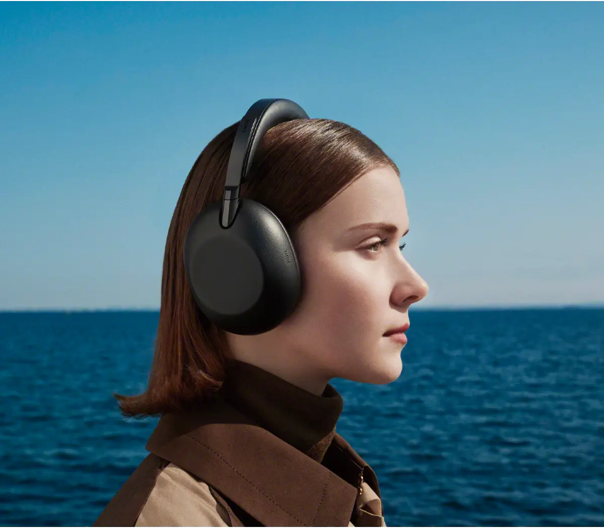 Woman wearing headphones on a clear day