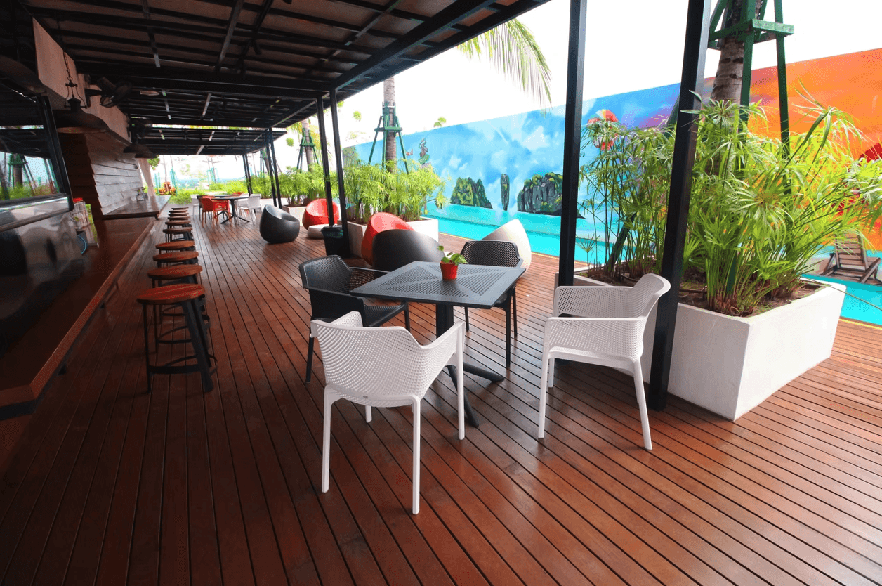 a room with a table, chairs, and a partition