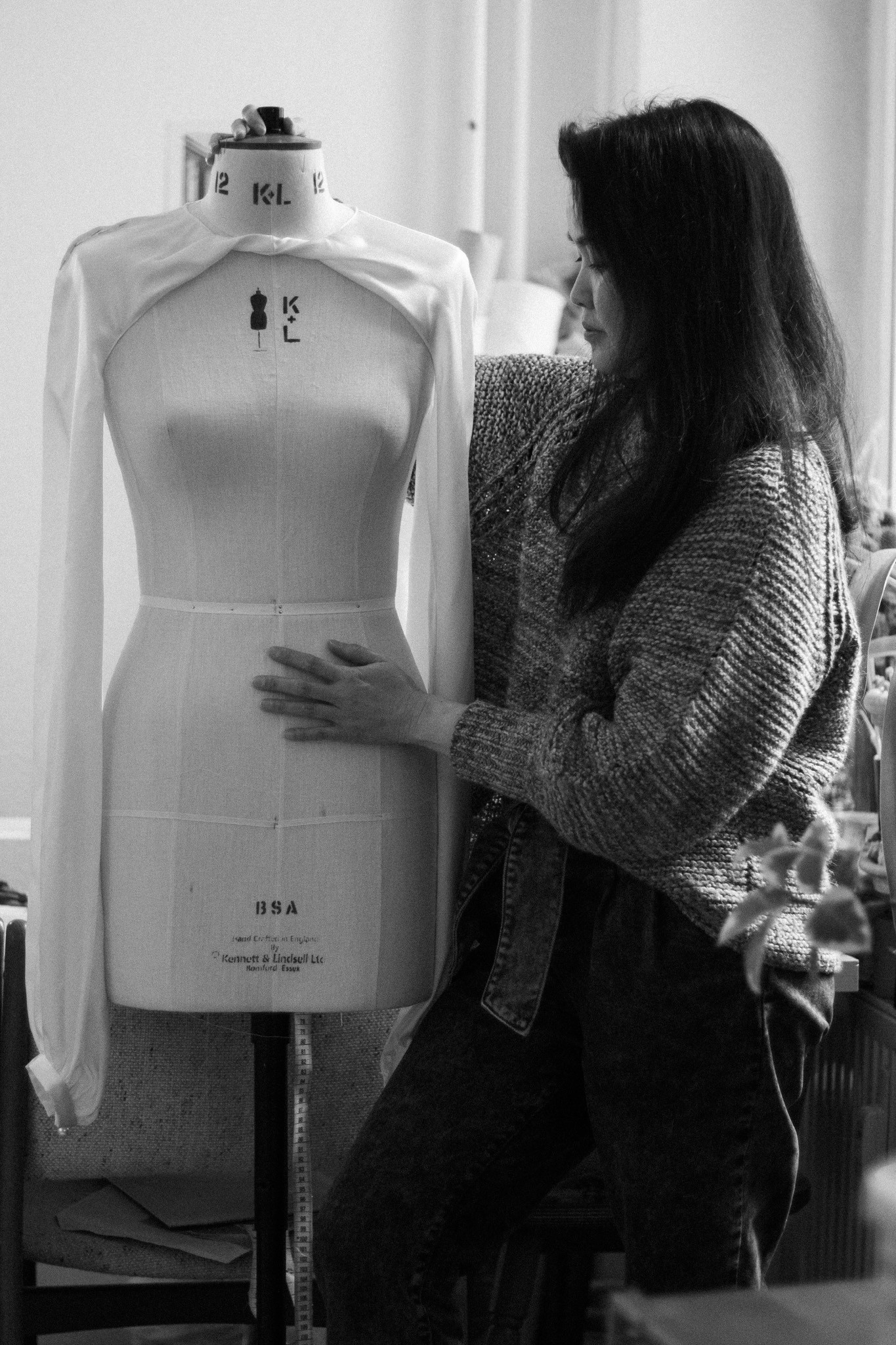 Photo of Maki, a wedding dress designer, working