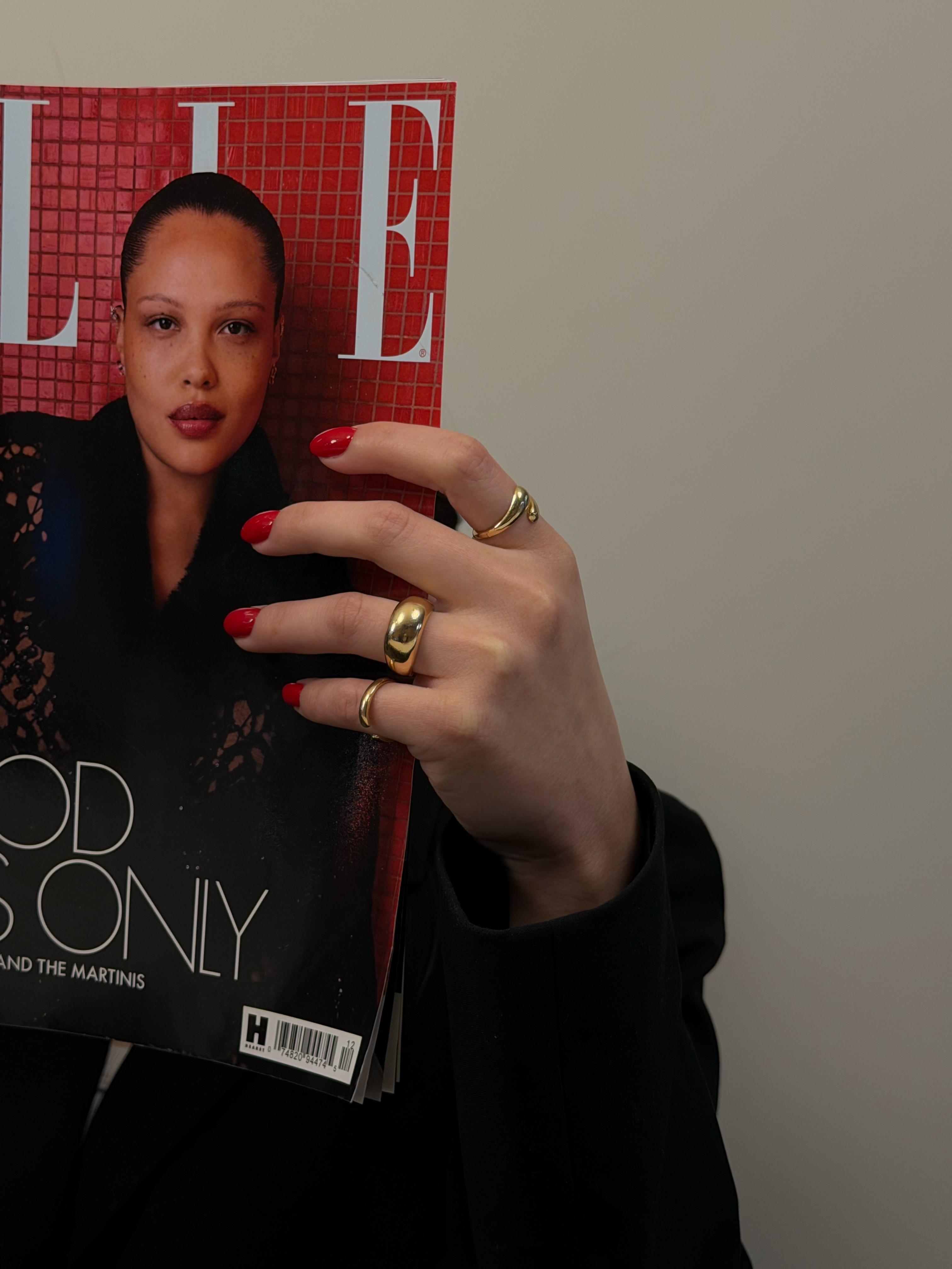 A woman lying down in a spa setting, relaxing with her eyes closed. Sunlight streams through blinds, casting striped shadows on her face. The scene conveys a sense of serenity and well-being.