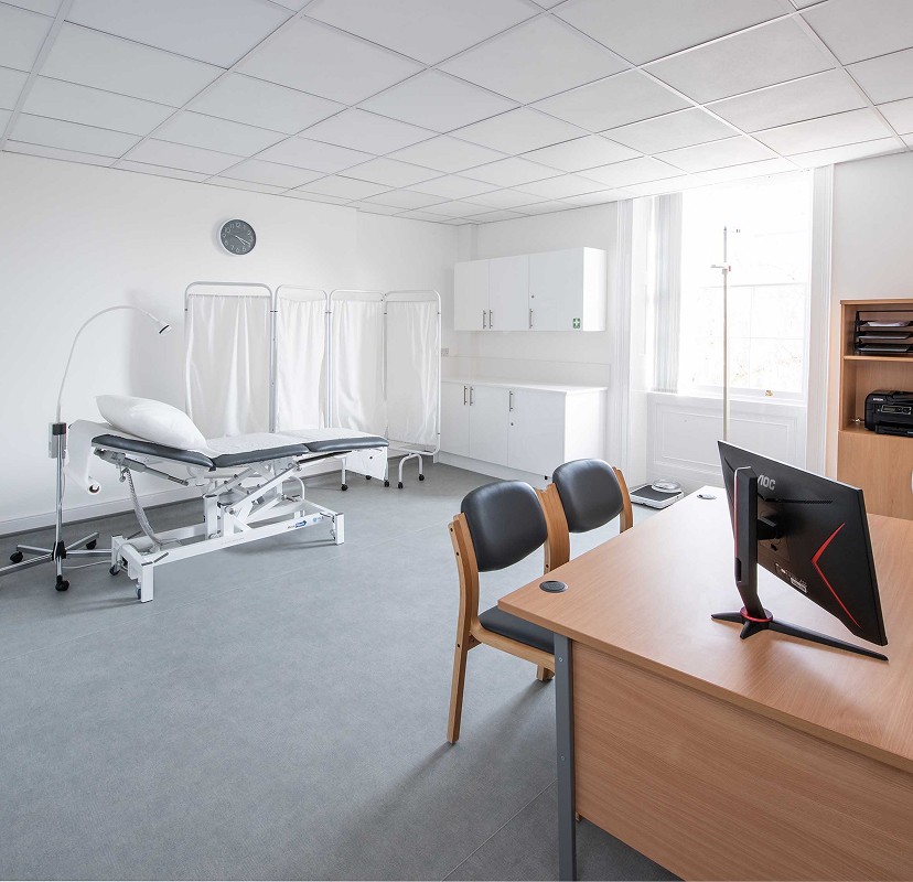 Dr. Adam Friedmann in front of his clinic