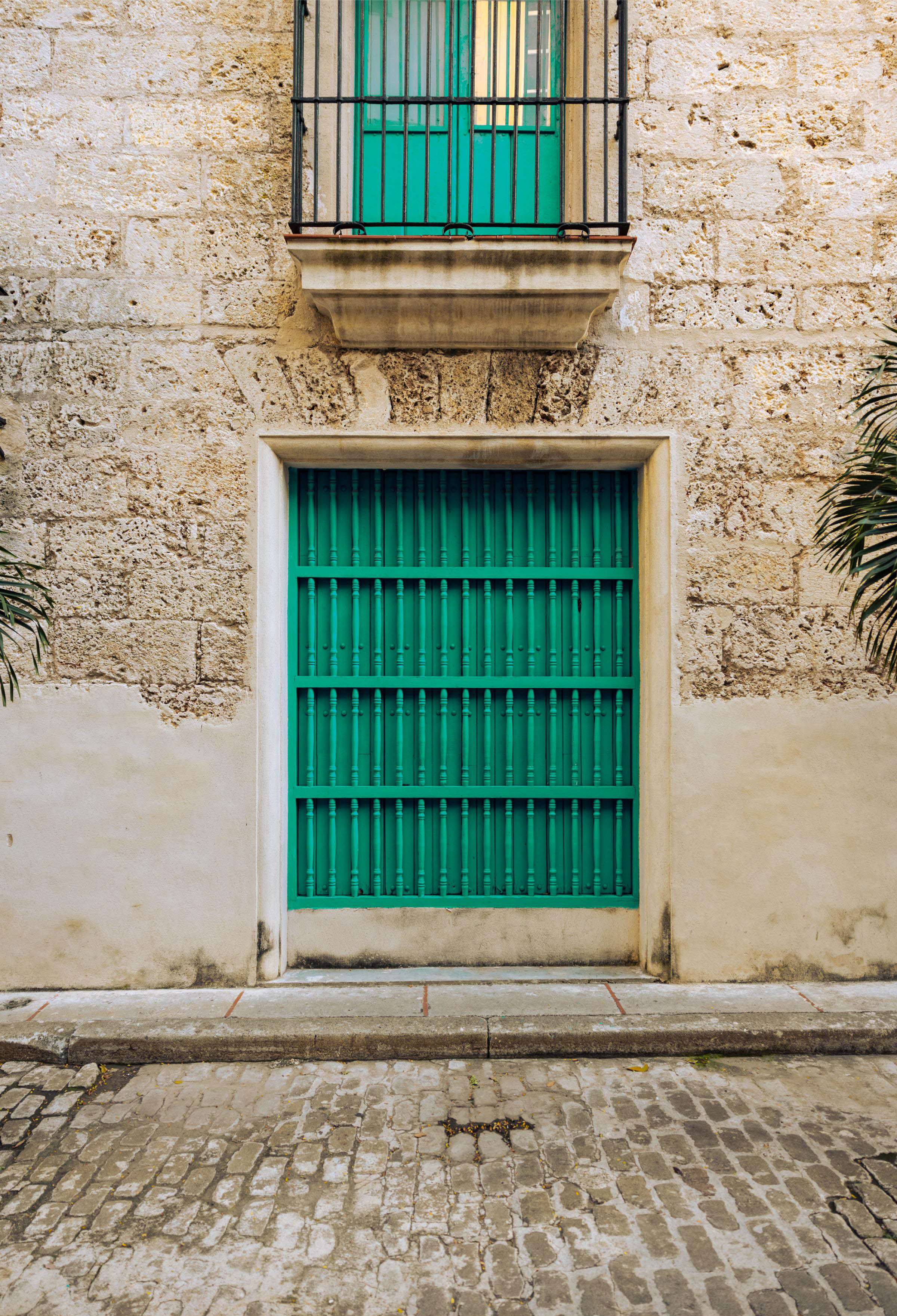 Beautiful window grill in Old Havana with 18th century barrotes (bars constructed of small turned wooden columns).