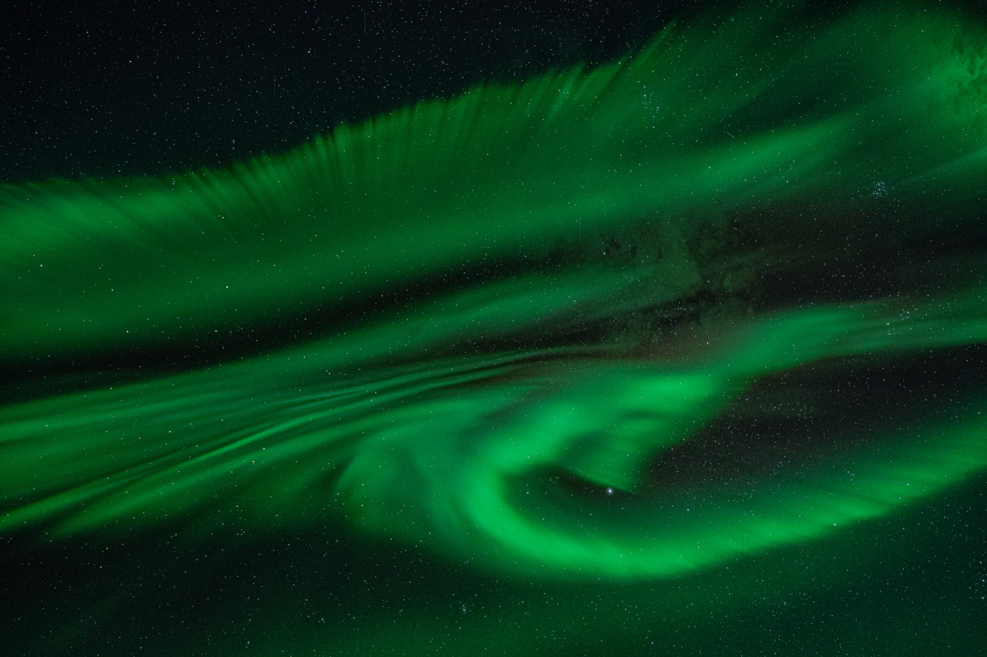 Northern Lights tour photography from Aurora Experts in Iceland, featuring guests beneath the aurora, winter landscapes, and vivid skies over remote Icelandic locations.