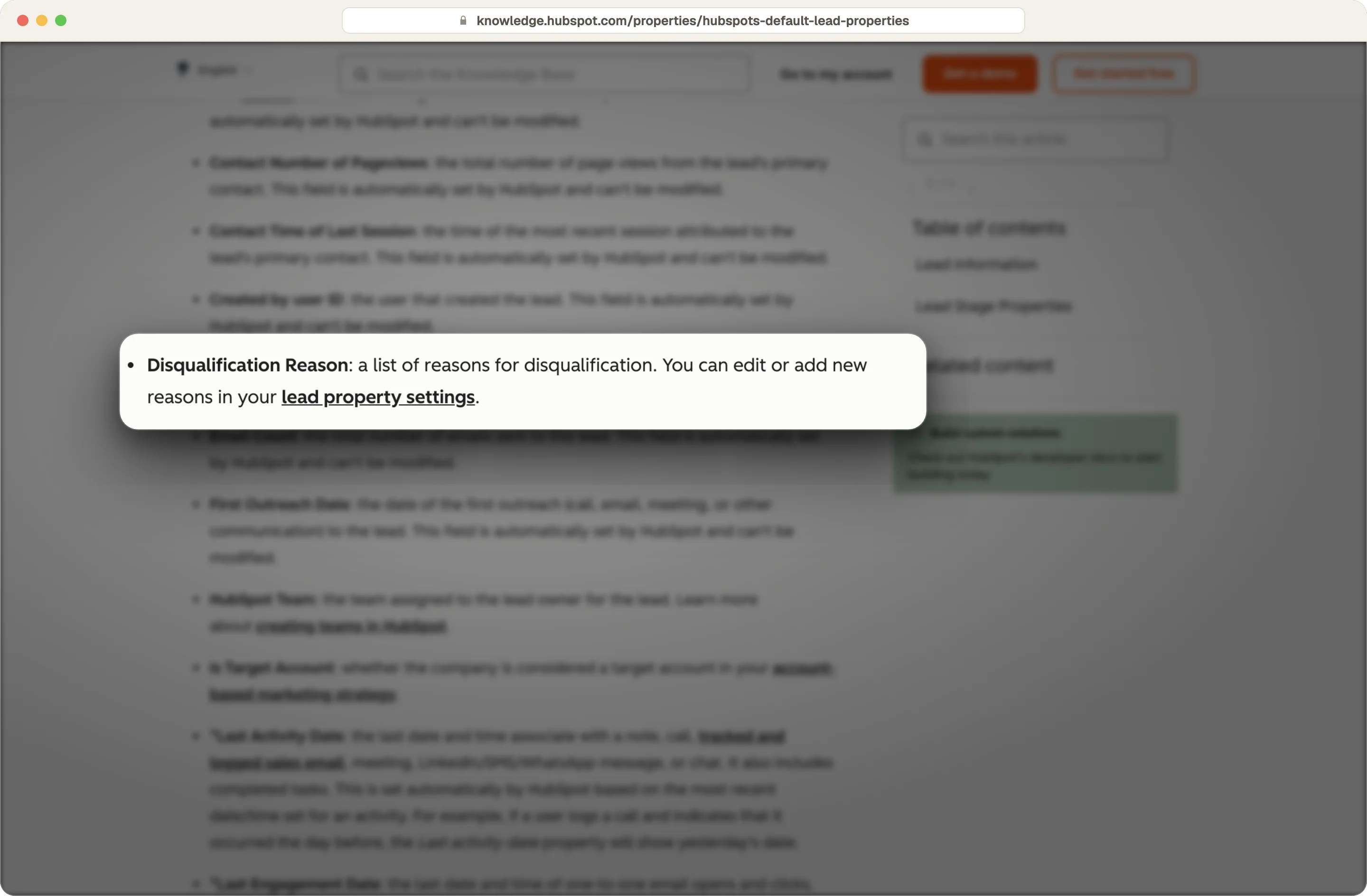 HubSpot default lead properties showing the editable Disqualification Reason property, highlighted on the page