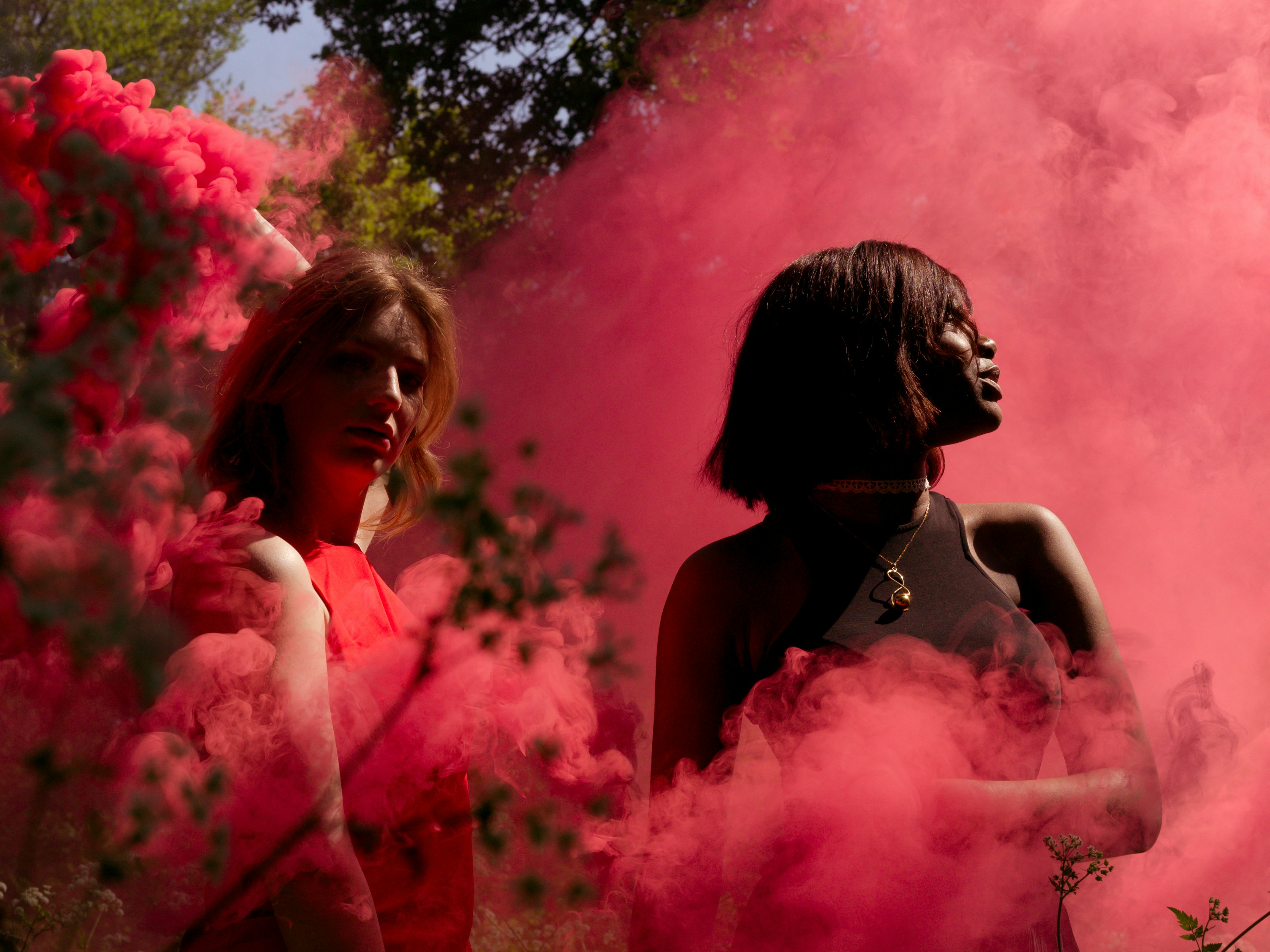 Girls Surrounded by Pink Smoke - Preppy Girl