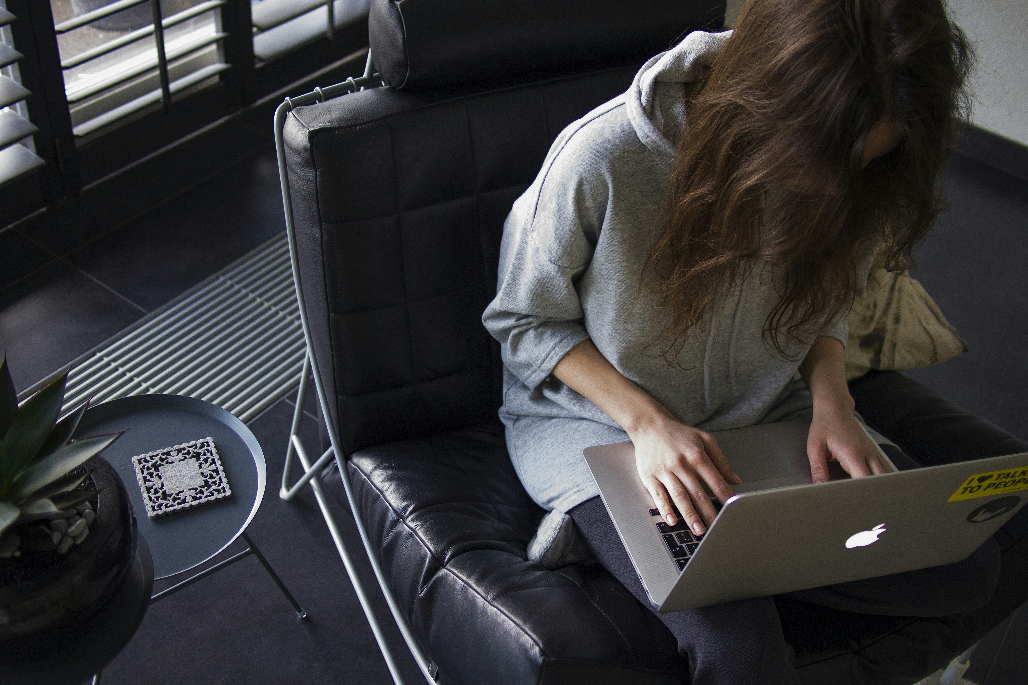 woman sitting alone in office - How To Summarize A Research Paper