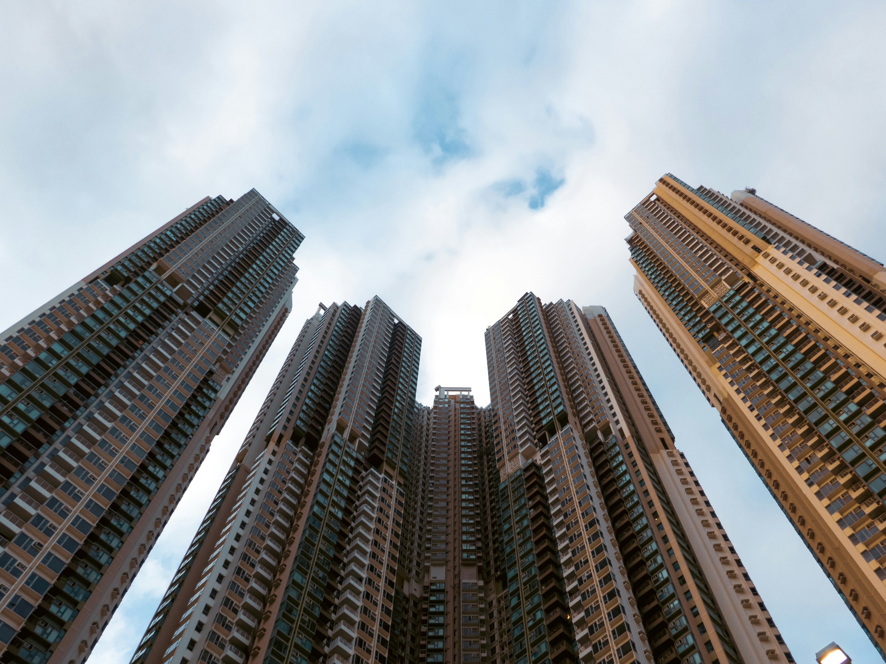 Looking up at tall buildings in a city