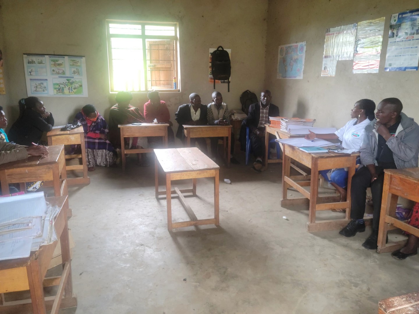 2 boys and girl playing soccer during daytime