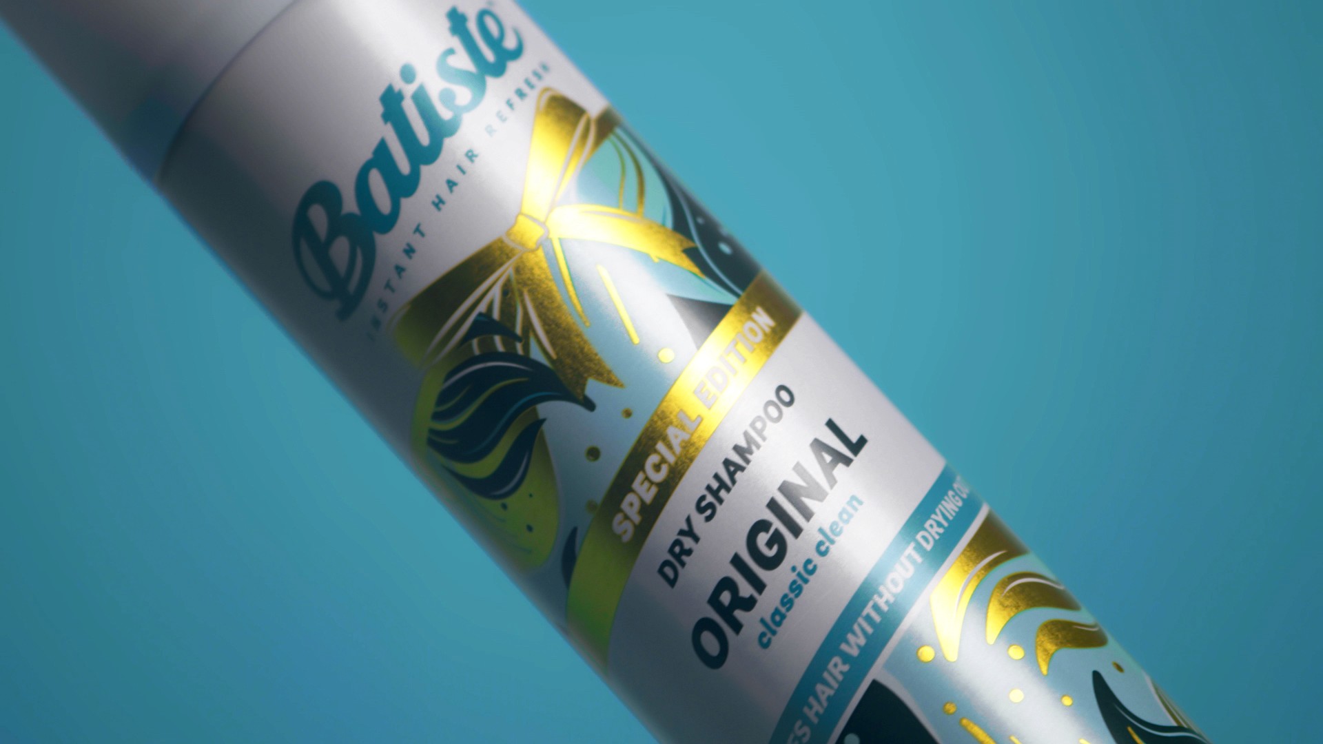 Close-up of Batiste dry shampoo bottle against blue backdrop