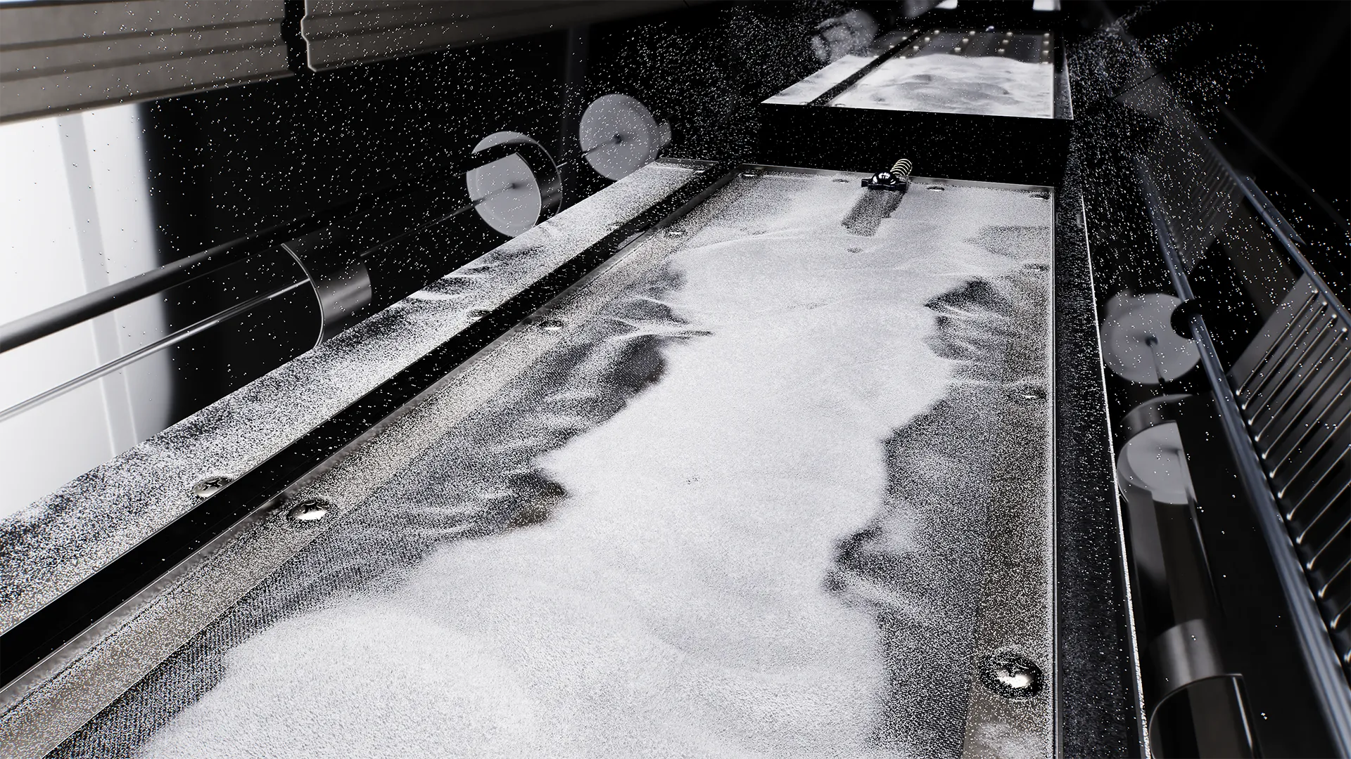 Inside view of the Dune X powder shaker showing the moving platen, which effectively filters out dust and impurities from the hot melt powder to enhance overall print quality.