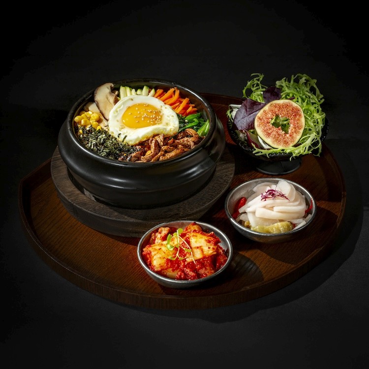 a bottle of alcohol sitting on top of a metal grate