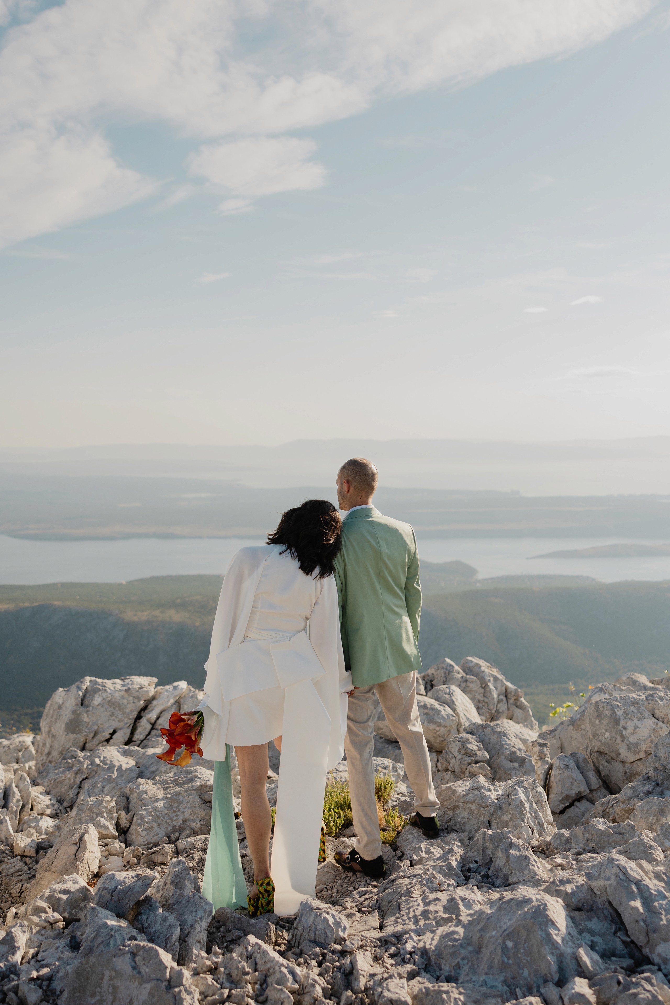 Lily flowers on outside dining table with candles