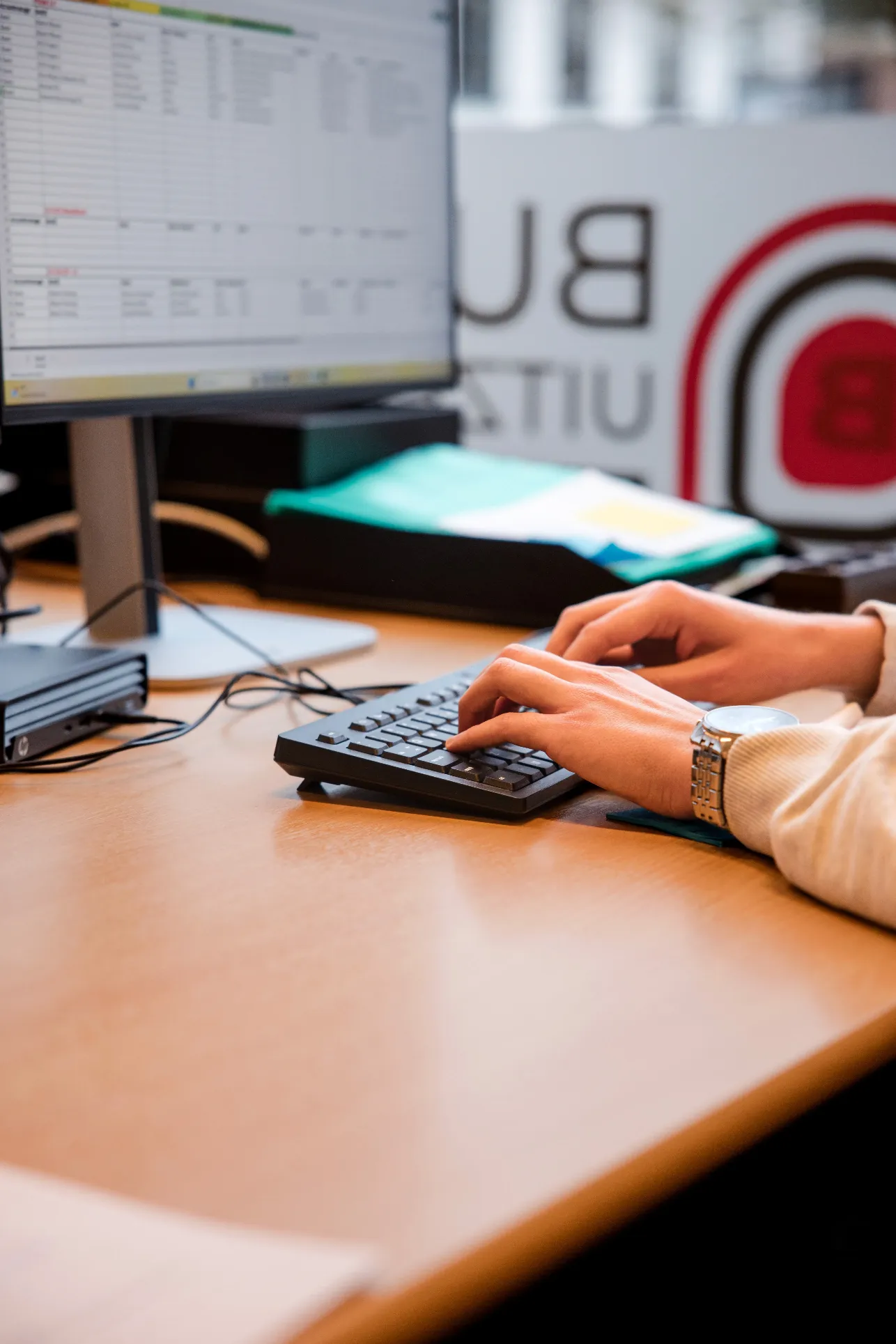 man in green and black plaid long sleeve shirt holding red and black cordless hand drill