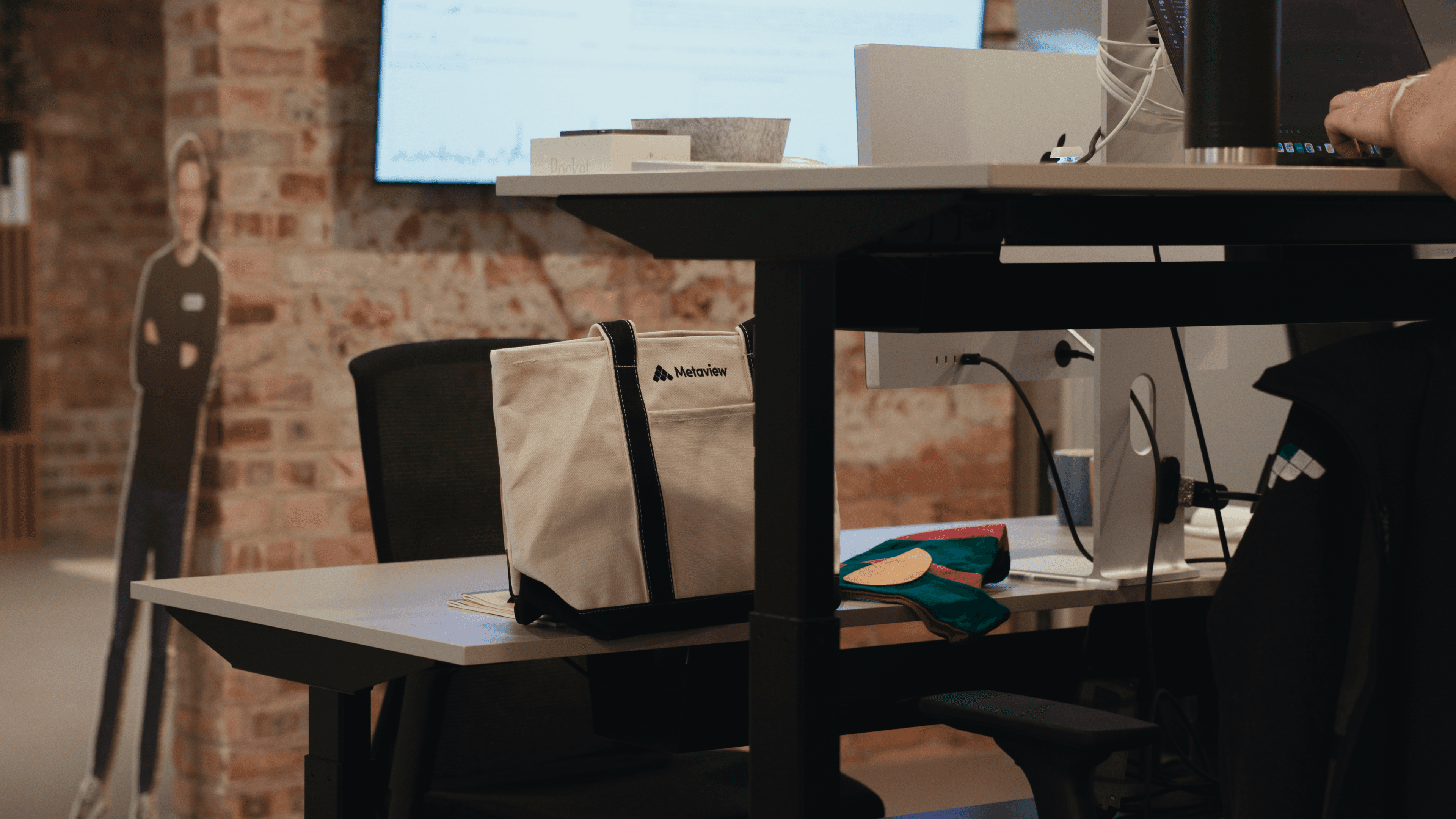 Metaview's custom dual color shopper tote on the desk