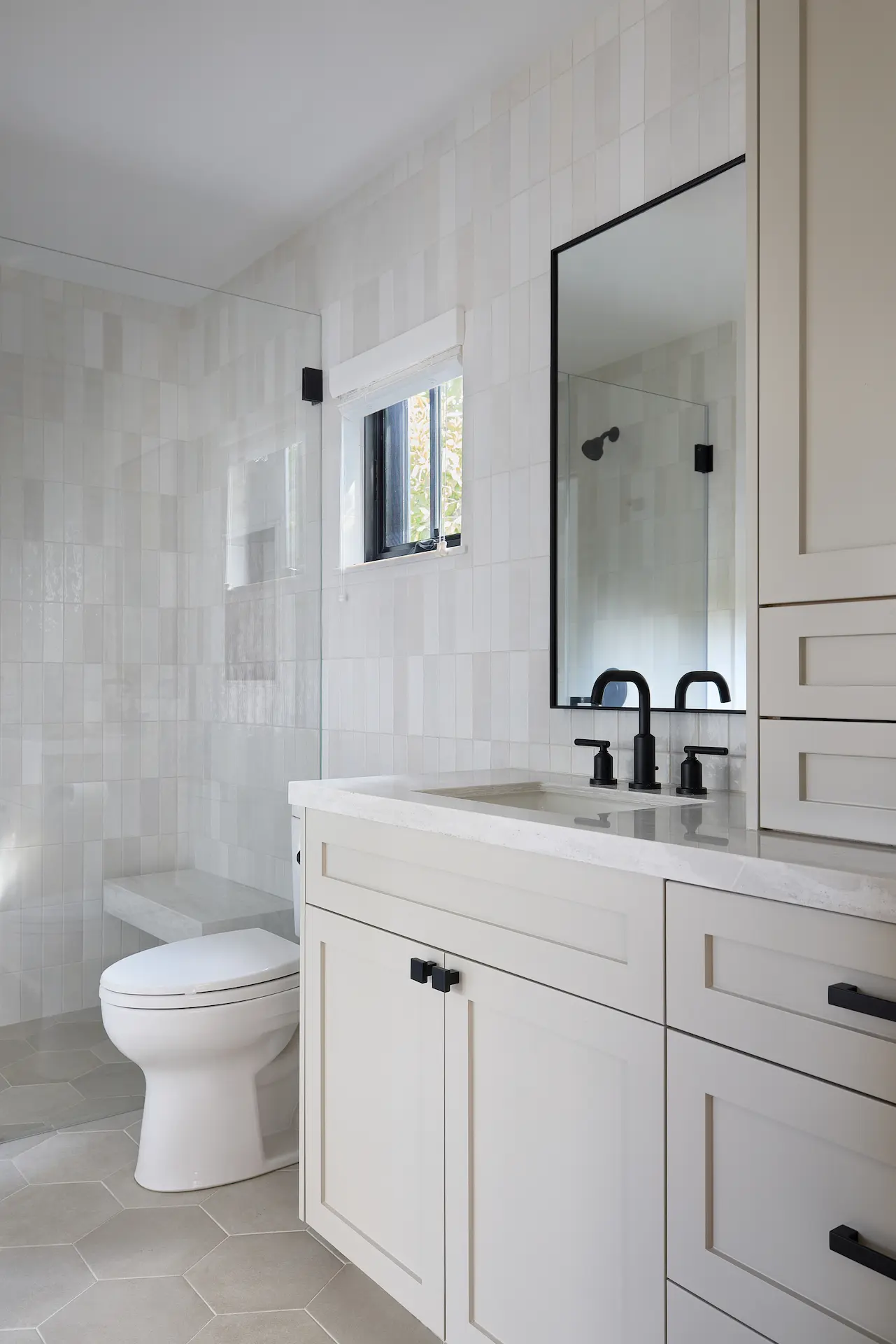 Full portrait of the bathroom at an angle, showcasing a blend of modern fixtures and timeless design in ADU Orange. Photo by Todd Huge.