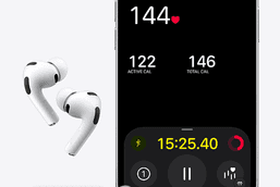 Wireless earbuds with built-in health sensors resting beside a charging case